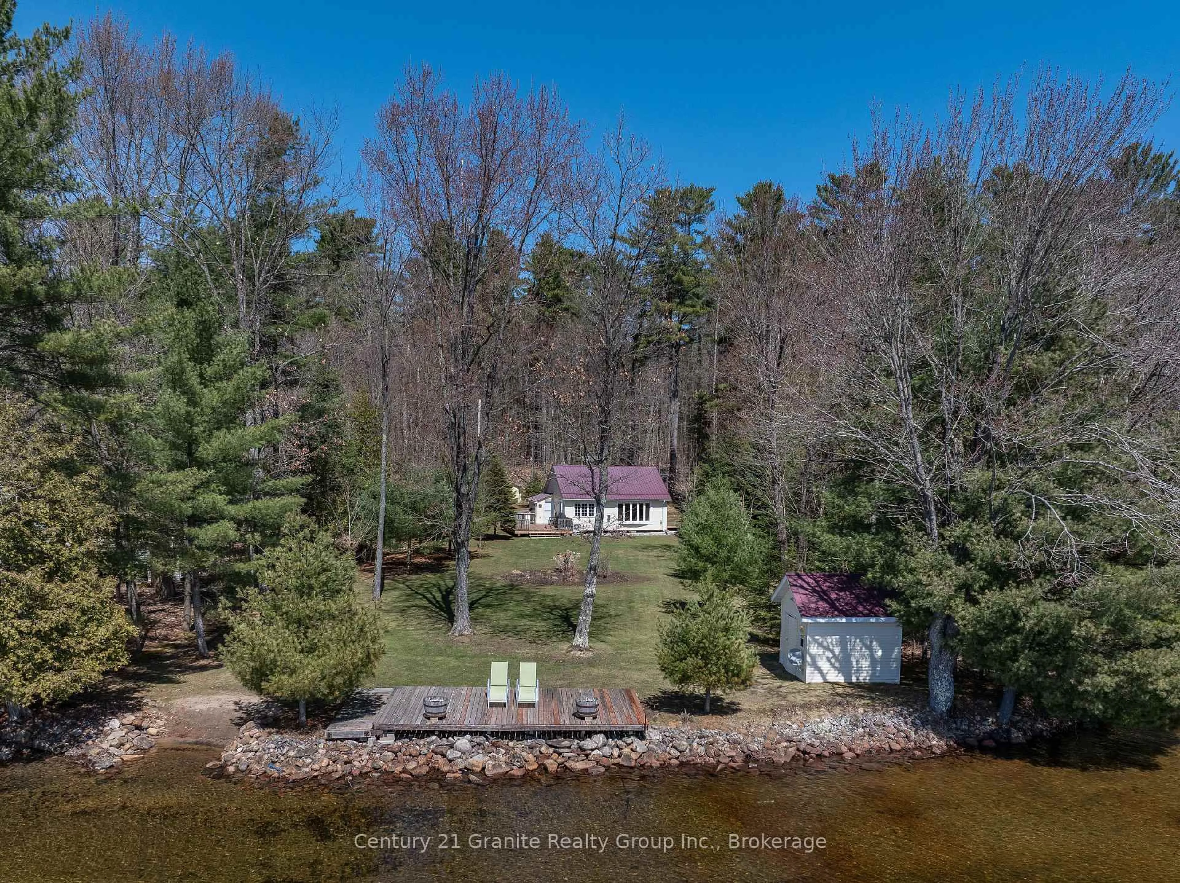 A pic from outside/outdoor area/front of a property/back of a property/a pic from drone, water/lake/river/ocean view for 1096 Donarvon Dr, Algonquin Highlands Ontario K0M 1S0