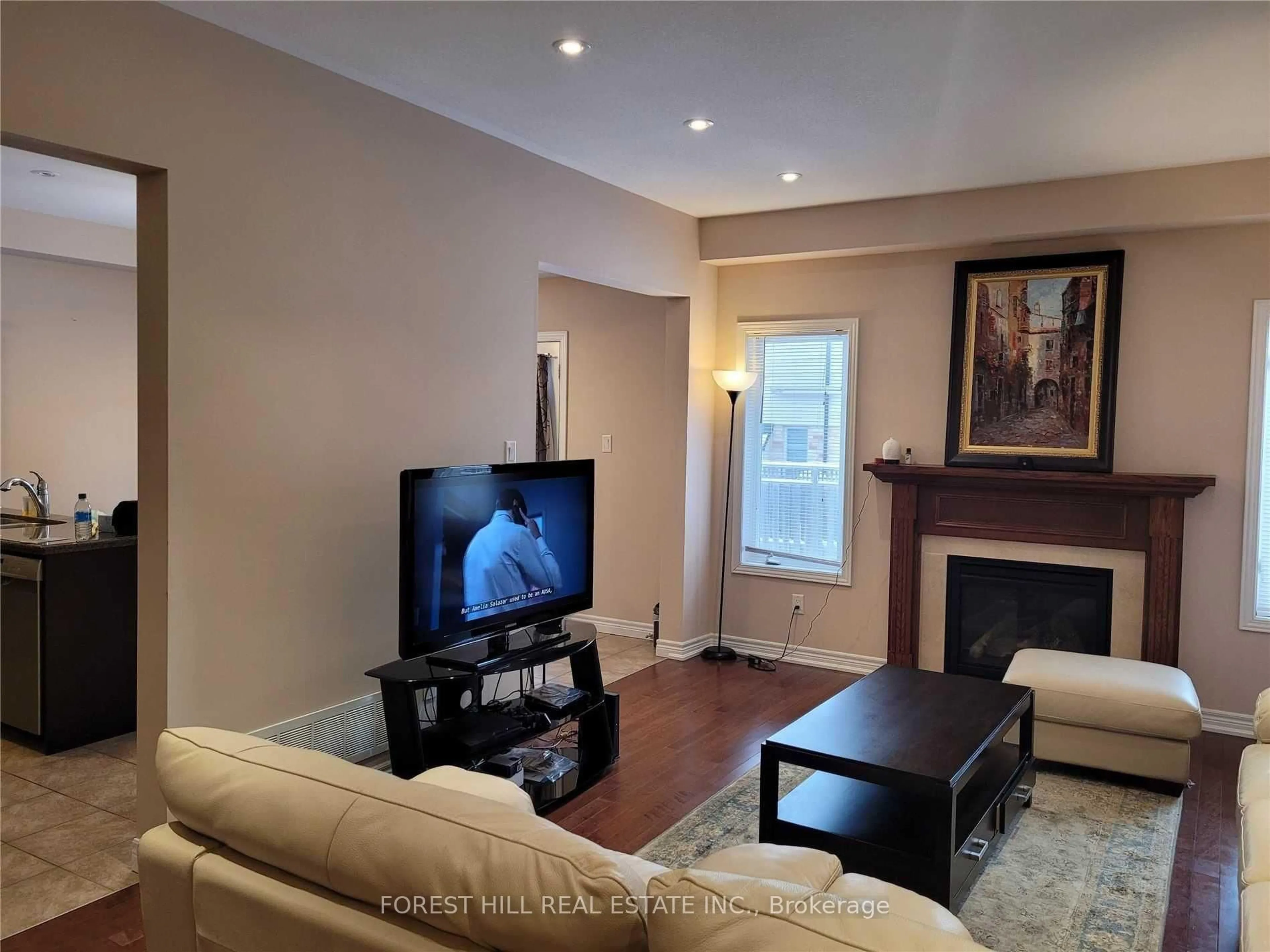 Living room with furniture, wood/laminate floor for 441 Stonehenge Dr #33, Hamilton Ontario L9K 0B1