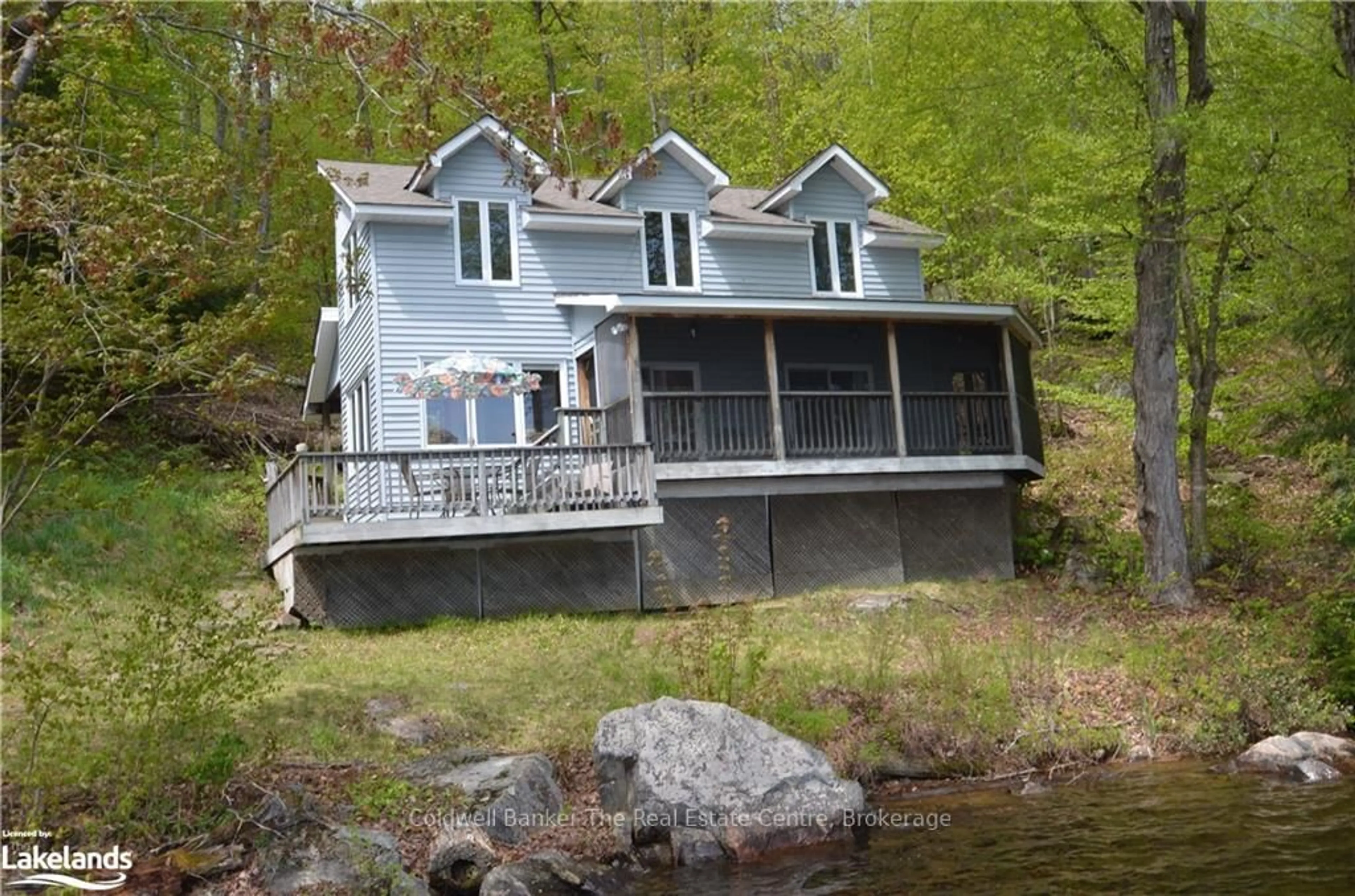 Home with vinyl exterior material, water/lake/river/ocean view for 10835 Raven - West Shore Way, Algonquin Highlands Ontario P0A 1E0