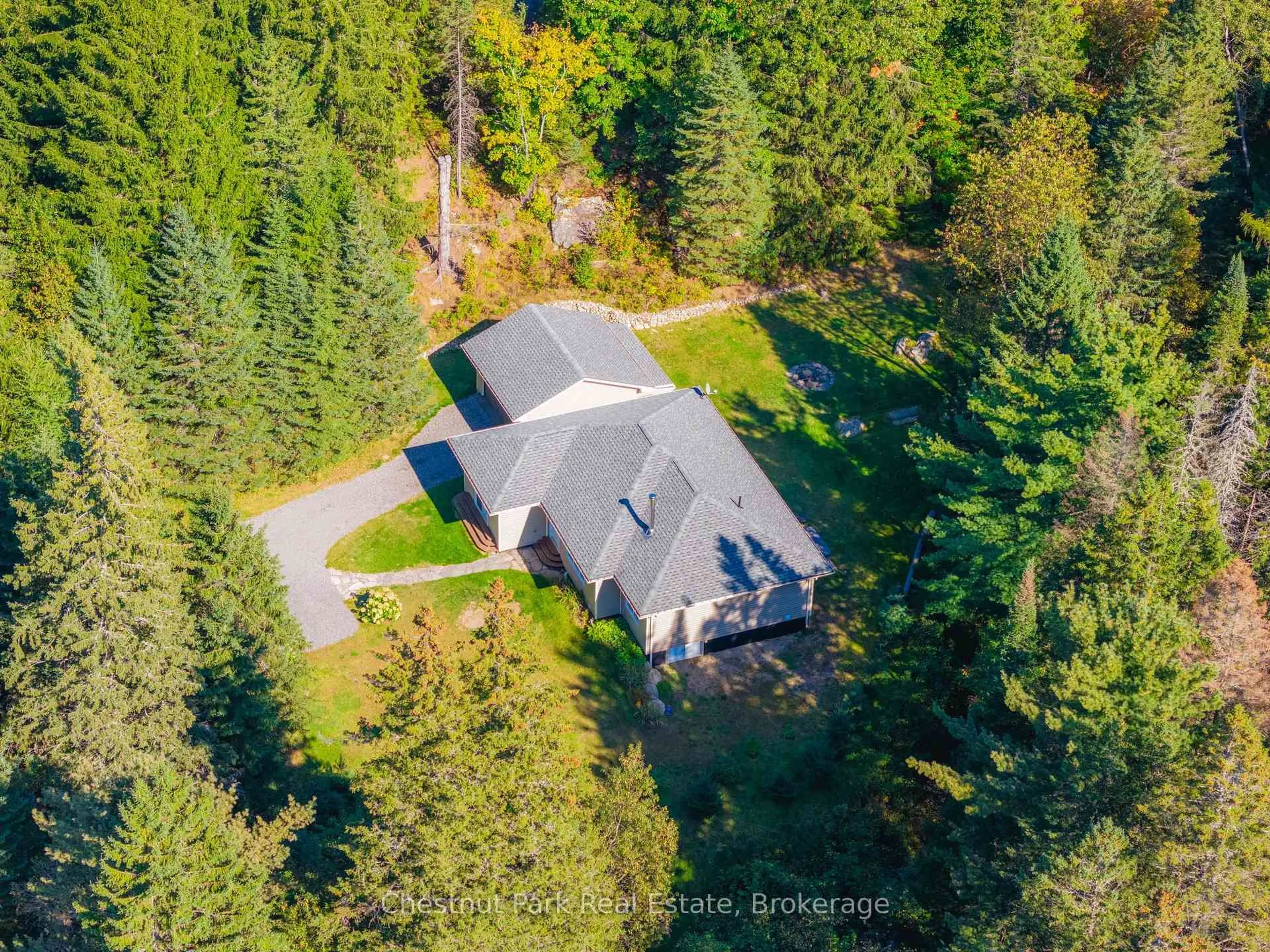 A pic from outside/outdoor area/front of a property/back of a property/a pic from drone, forest/trees view for 2253 Lone Pine Dr, Huntsville Ontario P0B 1L0