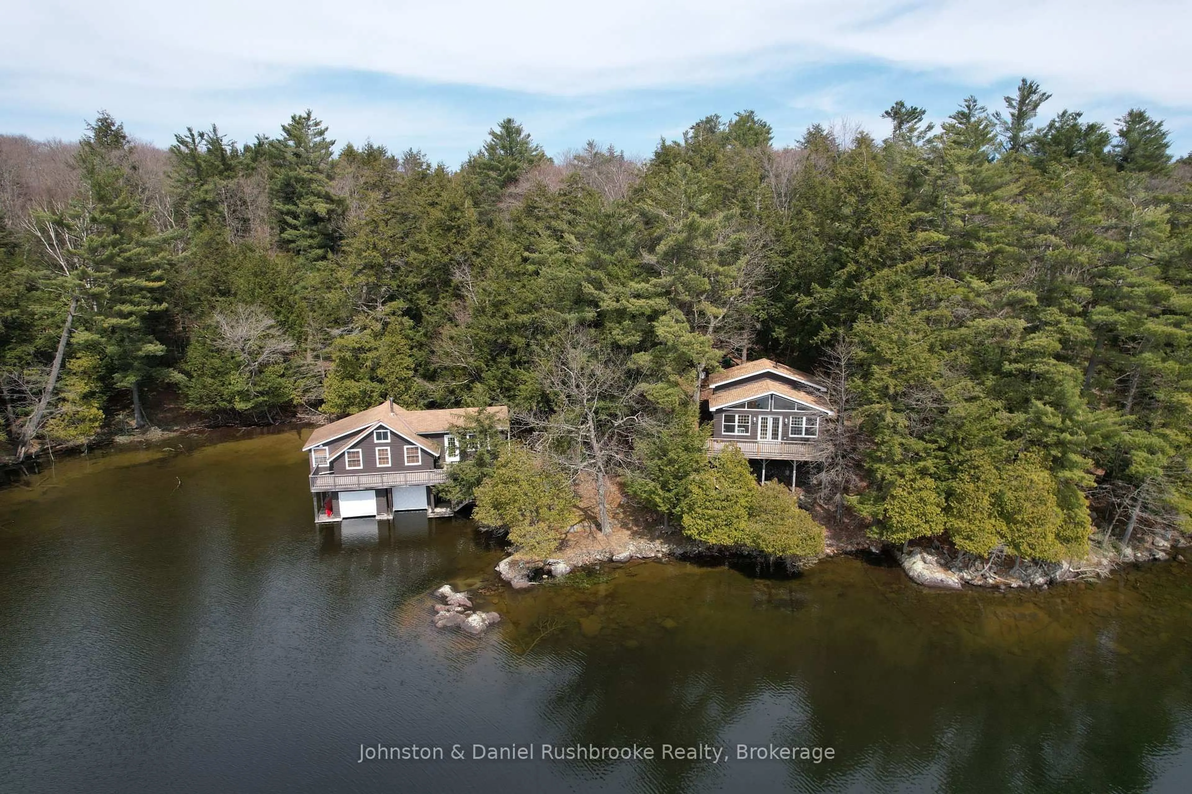 A pic from outside/outdoor area/front of a property/back of a property/a pic from drone, water/lake/river/ocean view for 1040 Old Township Rd, Muskoka Lakes Ontario P0B 1J0