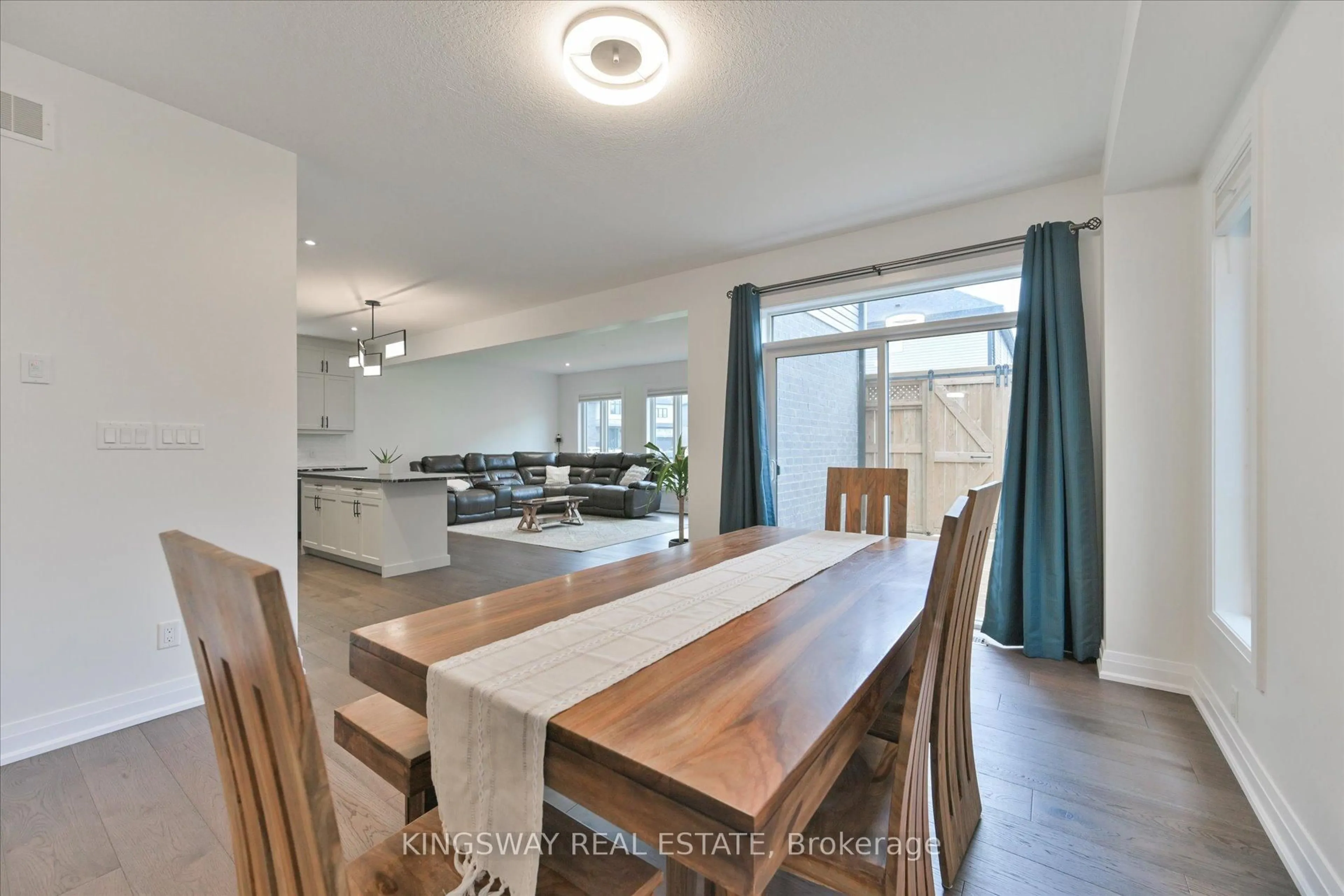 Open concept kitchen, wood/laminate floor for 75 Monarch Woods Dr, Kitchener Ontario N2P 2J6