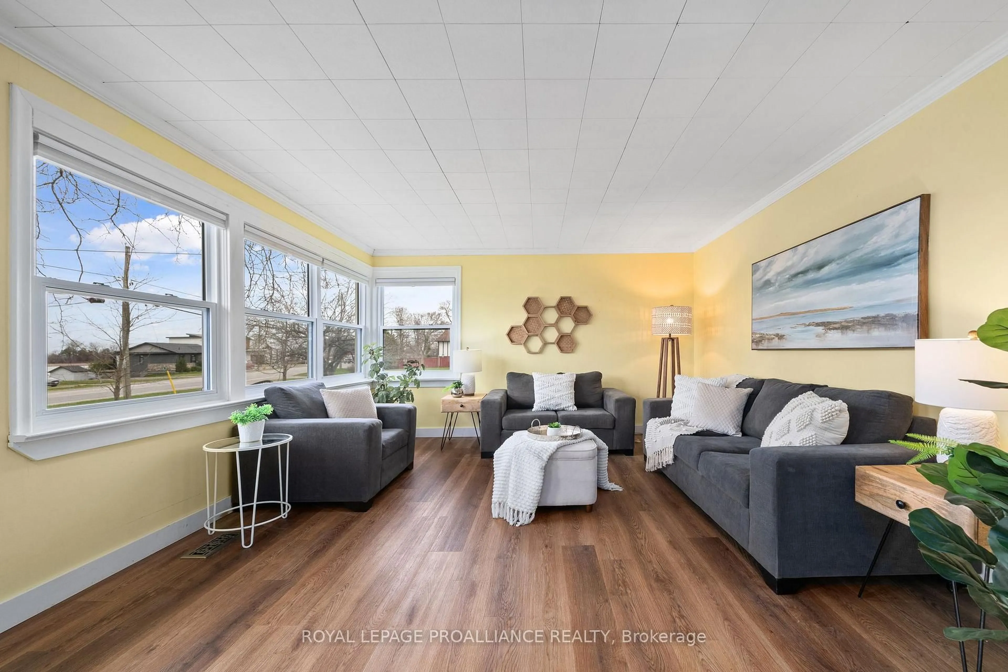 Living room with furniture, wood/laminate floor for 94 Main St, Prince Edward County Ontario K0K 3L0