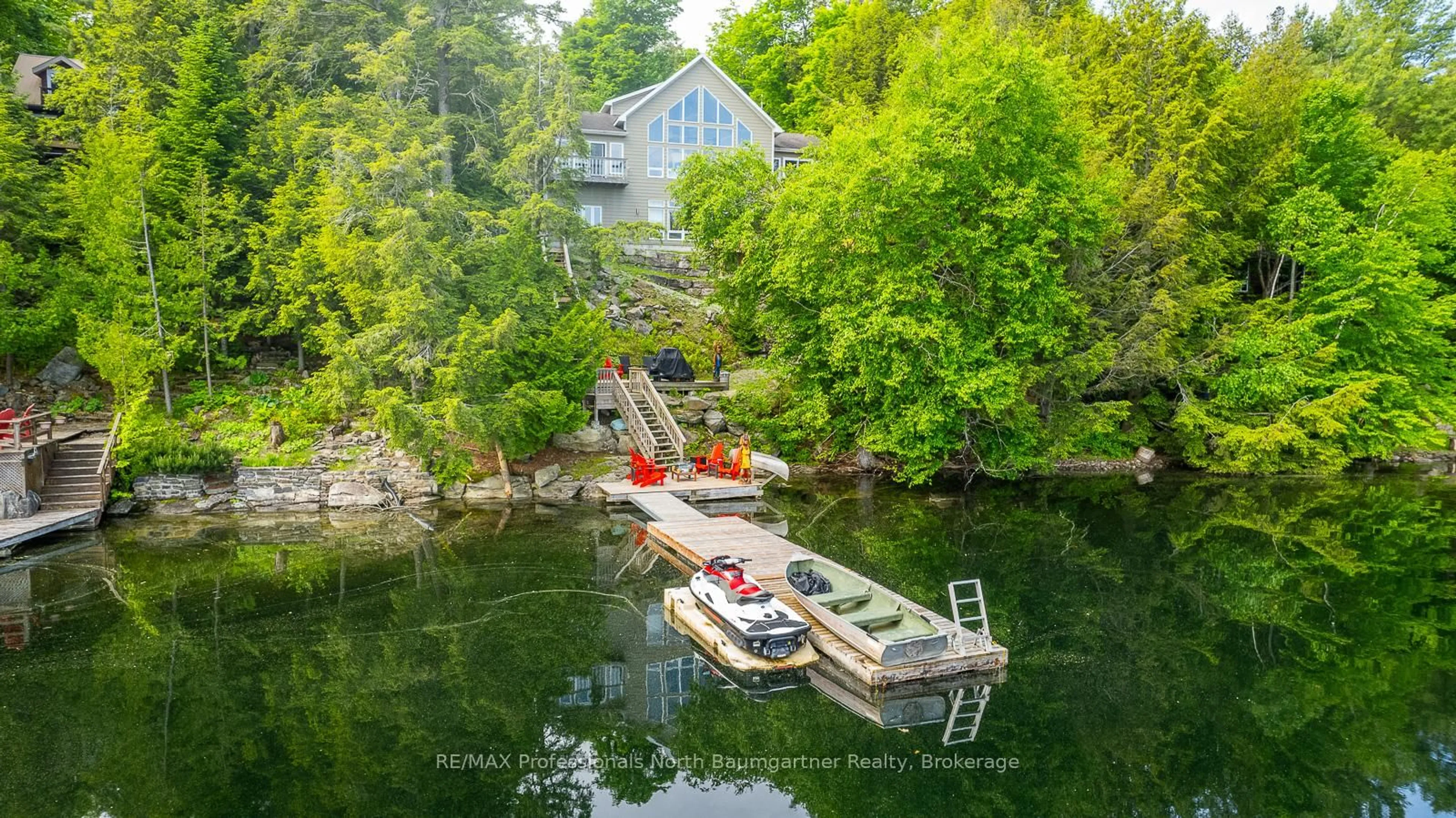 A pic from outside/outdoor area/front of a property/back of a property/a pic from drone, water/lake/river/ocean view for 1107 PINE POINT Rd, Dysart et al Ontario K0M 1S0