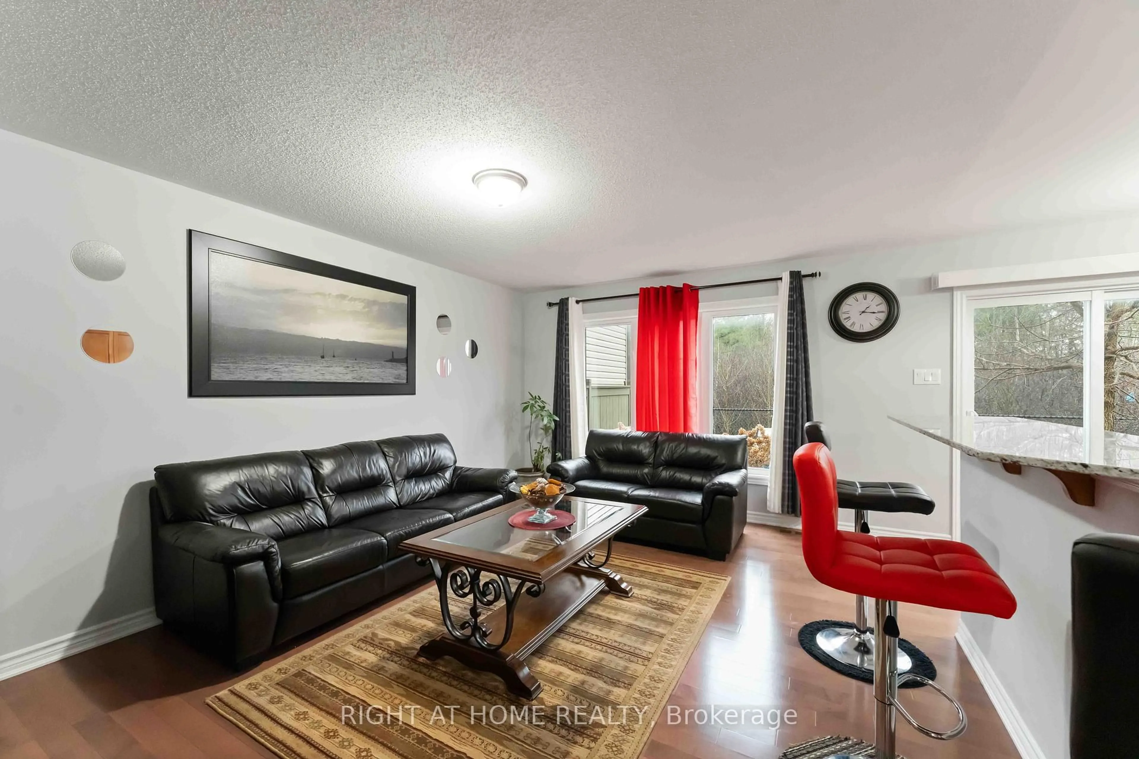 Living room with furniture, wood/laminate floor for 139 Maestro Ave, Ottawa Ontario K2S 0V4