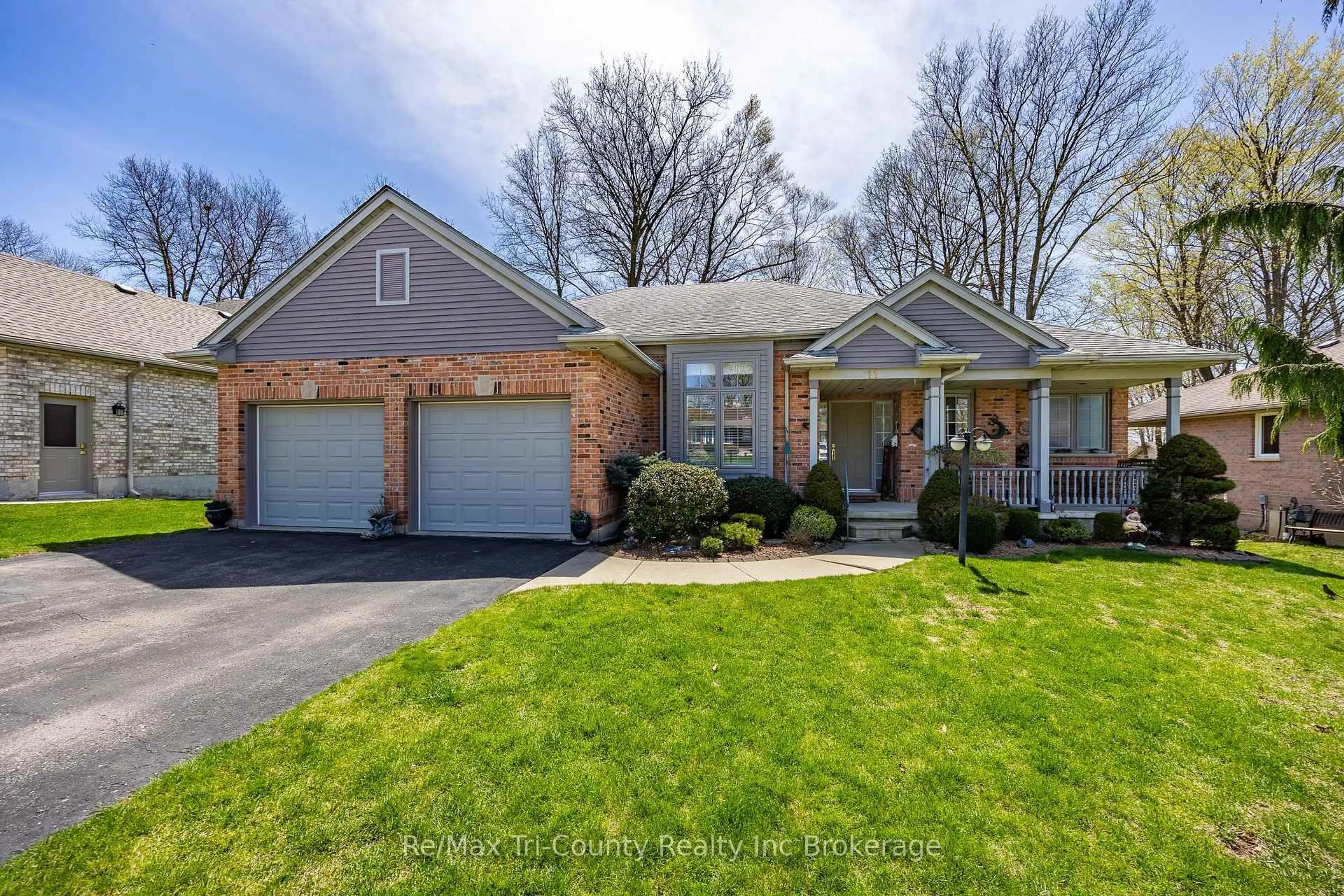 Home with brick exterior material, street for 11 Woodside Dr, Tillsonburg Ontario N4G 5P9