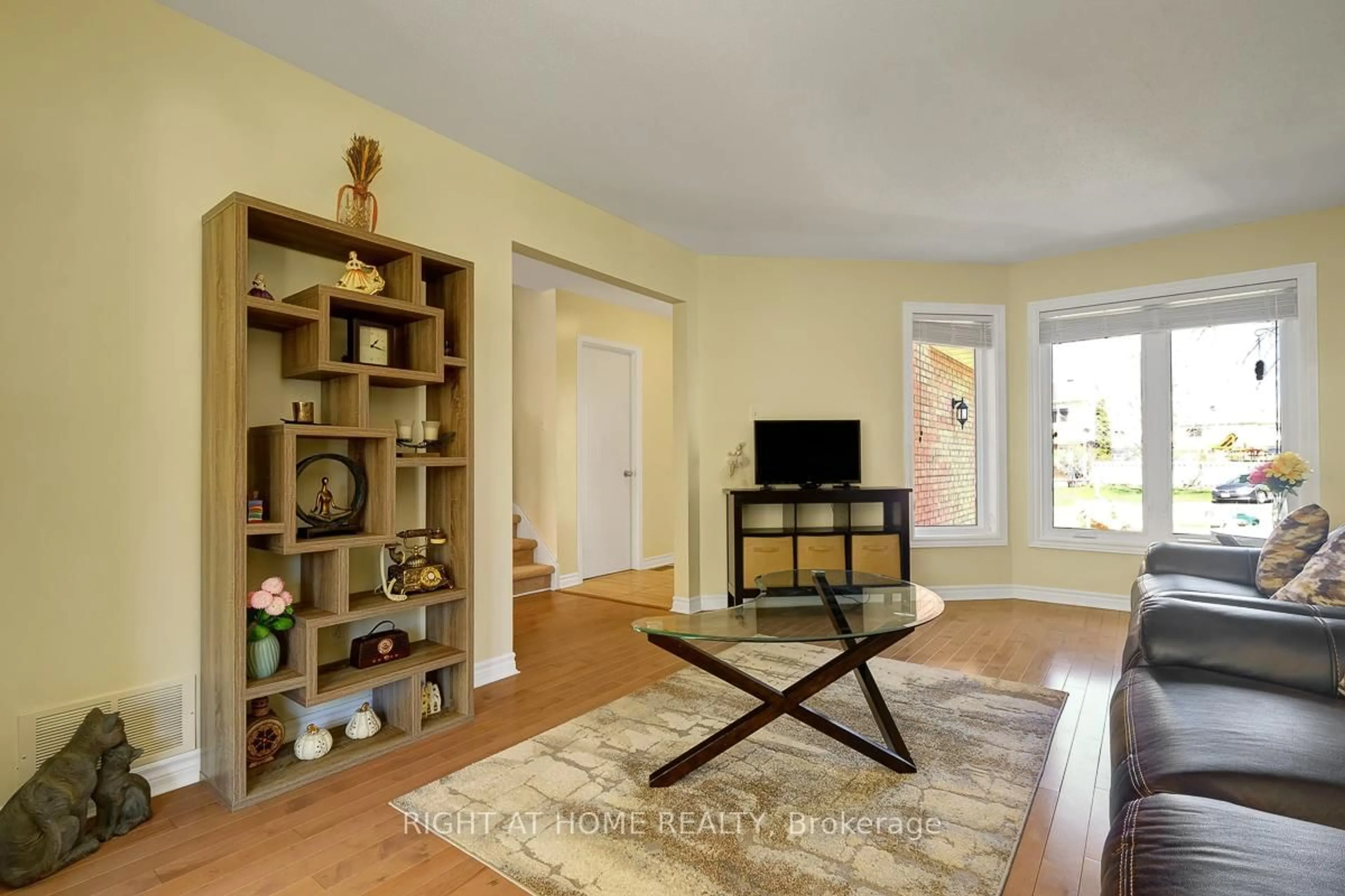 Living room with furniture, wood/laminate floor for 60 Kimbolton Cres, Ottawa Ontario K2K 2S4