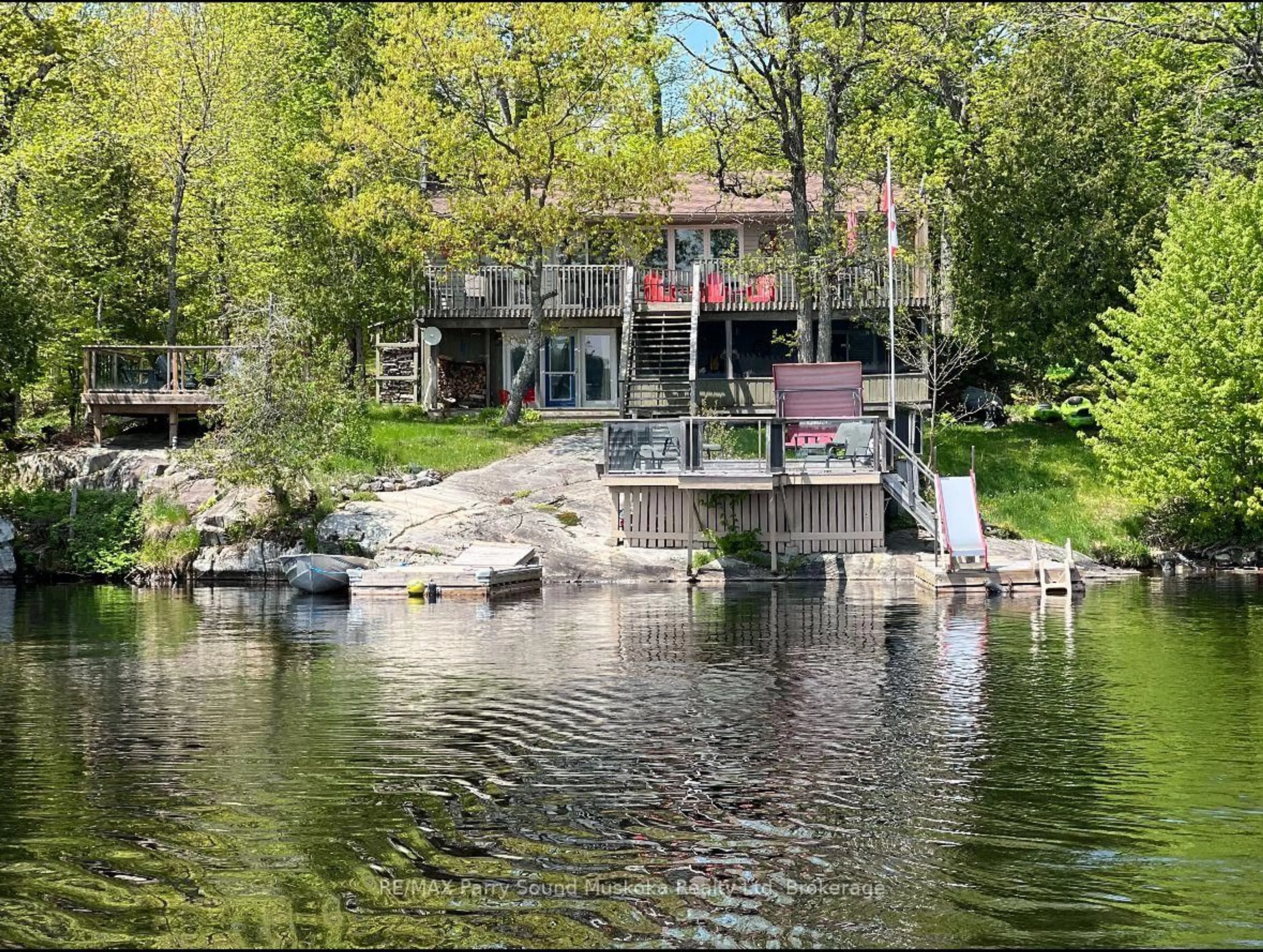 A pic from outside/outdoor area/front of a property/back of a property/a pic from drone, water/lake/river/ocean view for 115 Manitou Dr, McKellar Ontario P2A 0B4