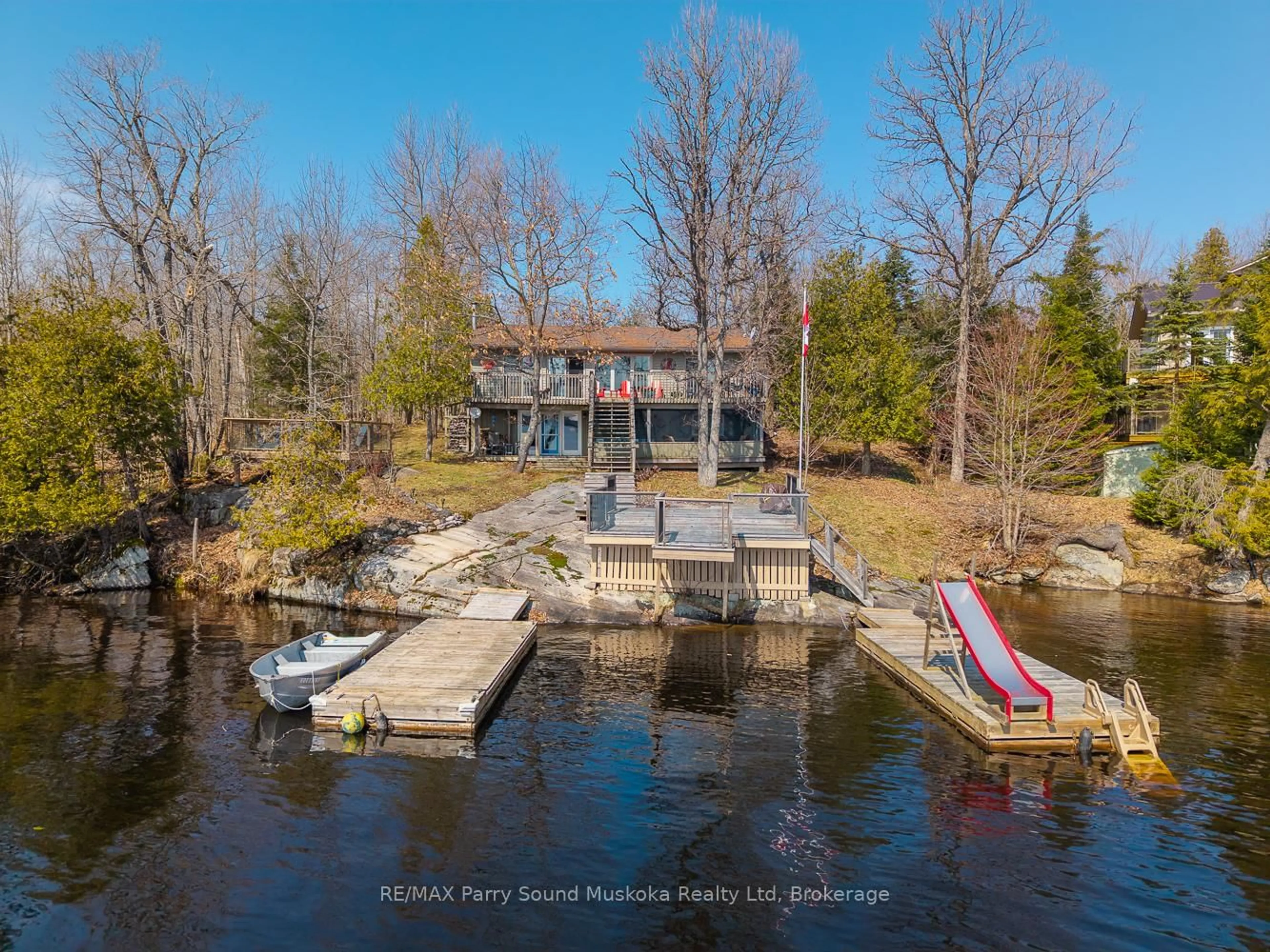 A pic from outside/outdoor area/front of a property/back of a property/a pic from drone, water/lake/river/ocean view for 115 Manitou Dr, McKellar Ontario P2A 0B4