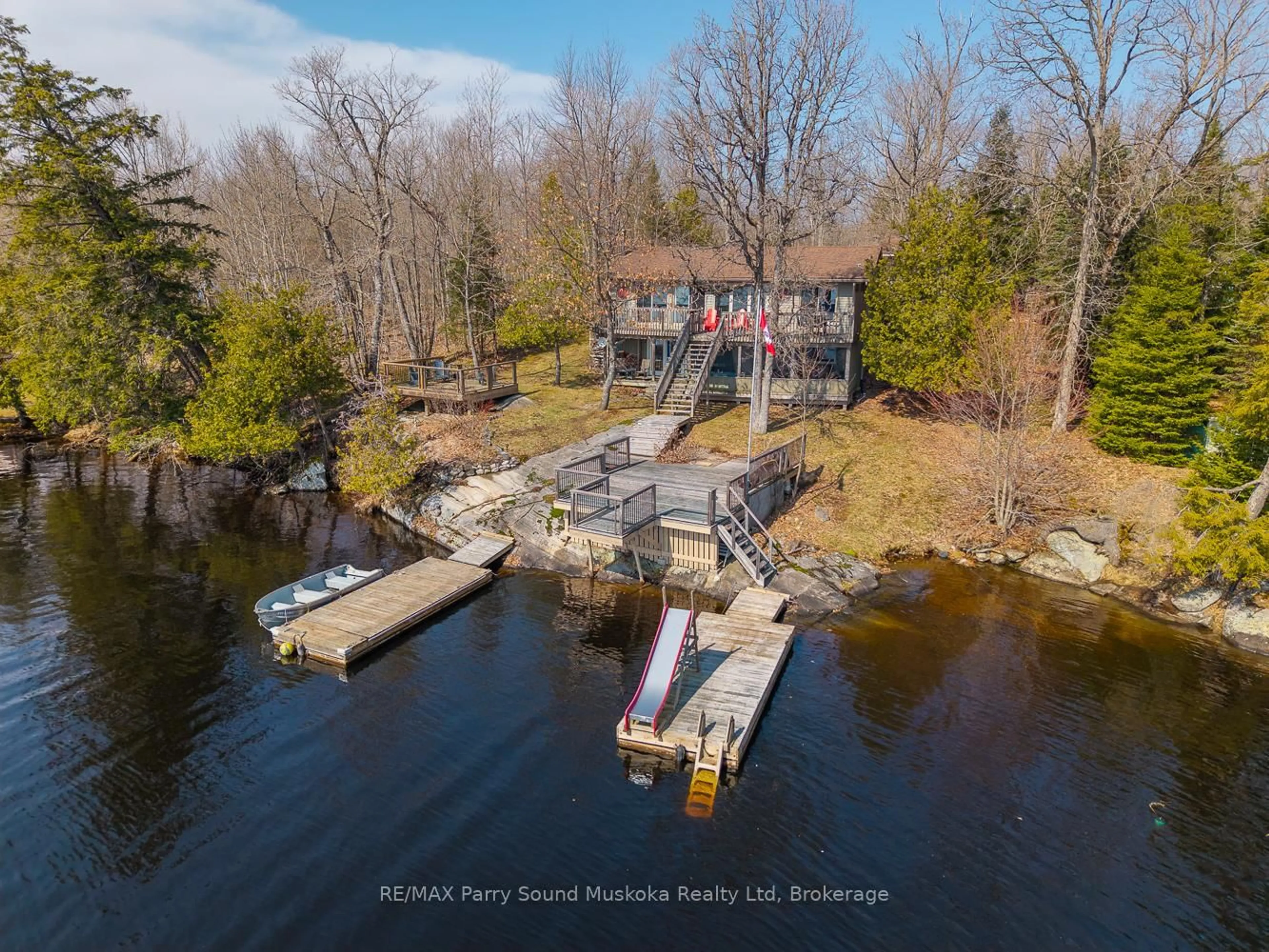 A pic from outside/outdoor area/front of a property/back of a property/a pic from drone, water/lake/river/ocean view for 115 Manitou Dr, McKellar Ontario P2A 0B4