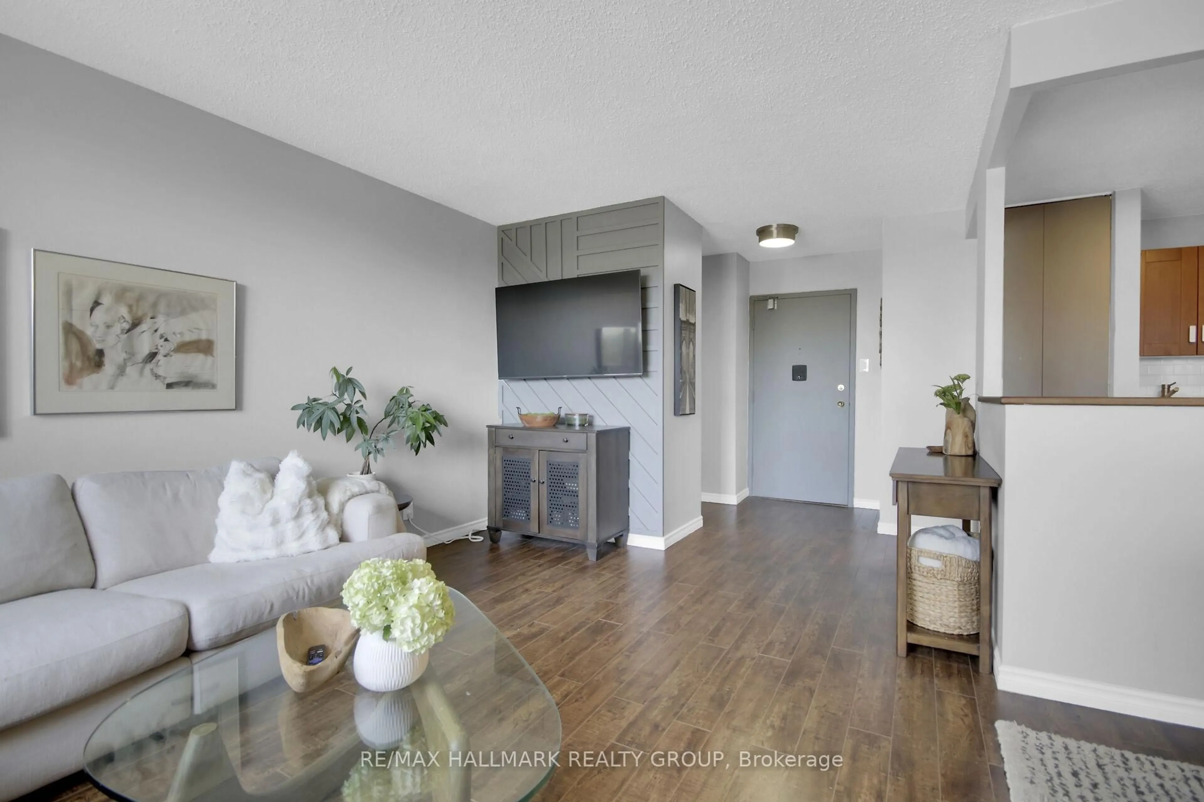 Living room with furniture, wood/laminate floor for 1285 Cahill Dr #408, Ottawa Ontario K1V 9A7