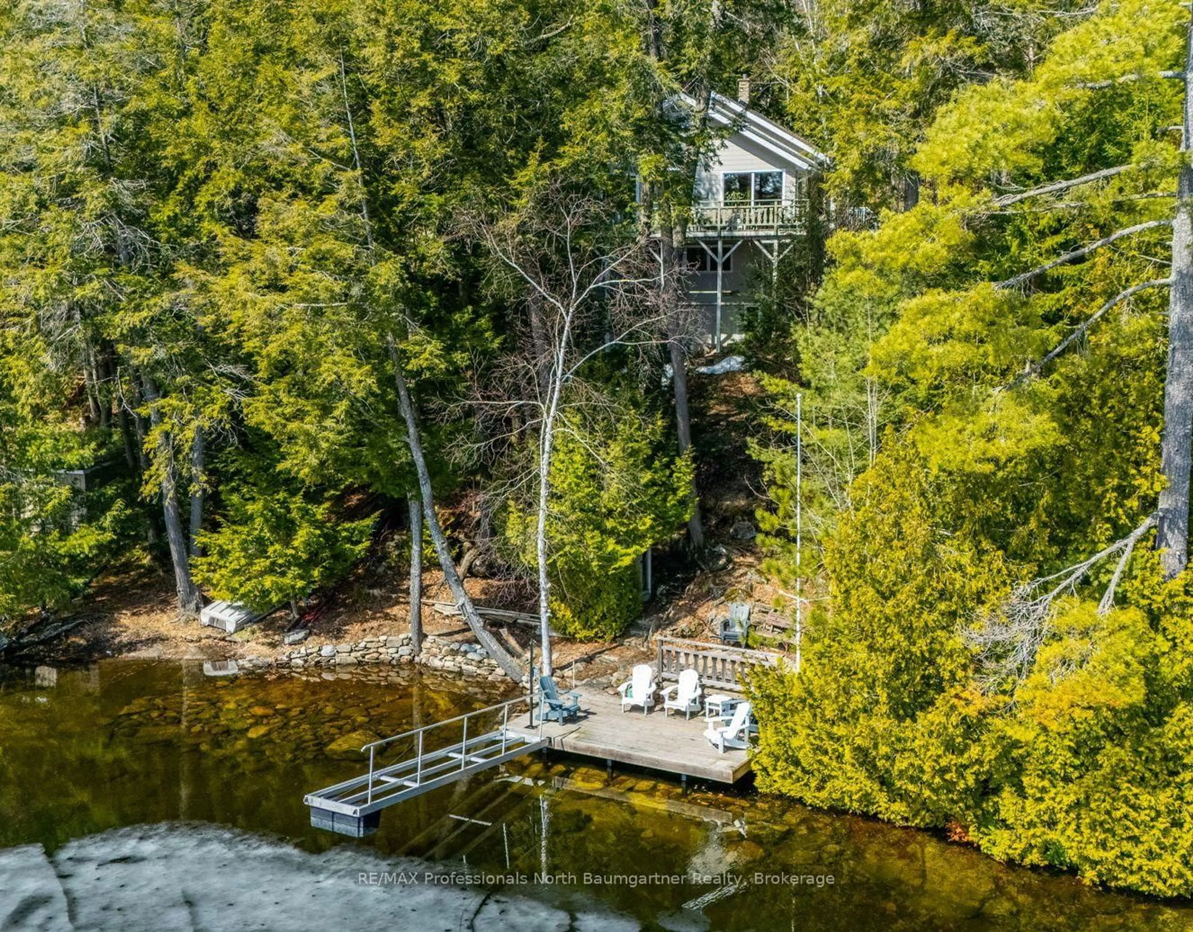 A pic from outside/outdoor area/front of a property/back of a property/a pic from drone, water/lake/river/ocean view for 6187 Kennisis Lake Rd, Dysart et al Ontario K0M 1S0