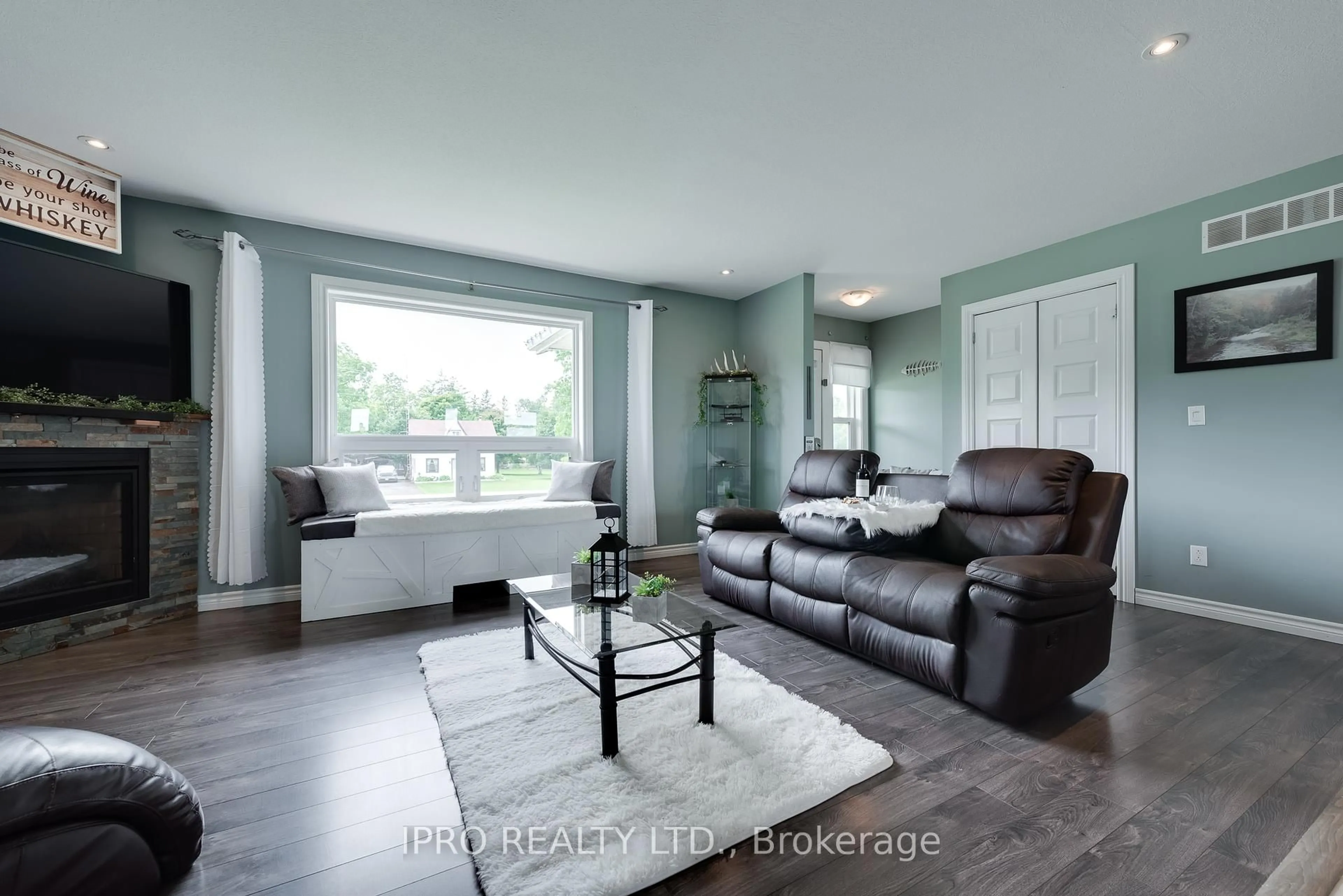 Living room with furniture, wood/laminate floor for 8961 Wellington Road 16 N/A, Wellington North Ontario N0G 2E0