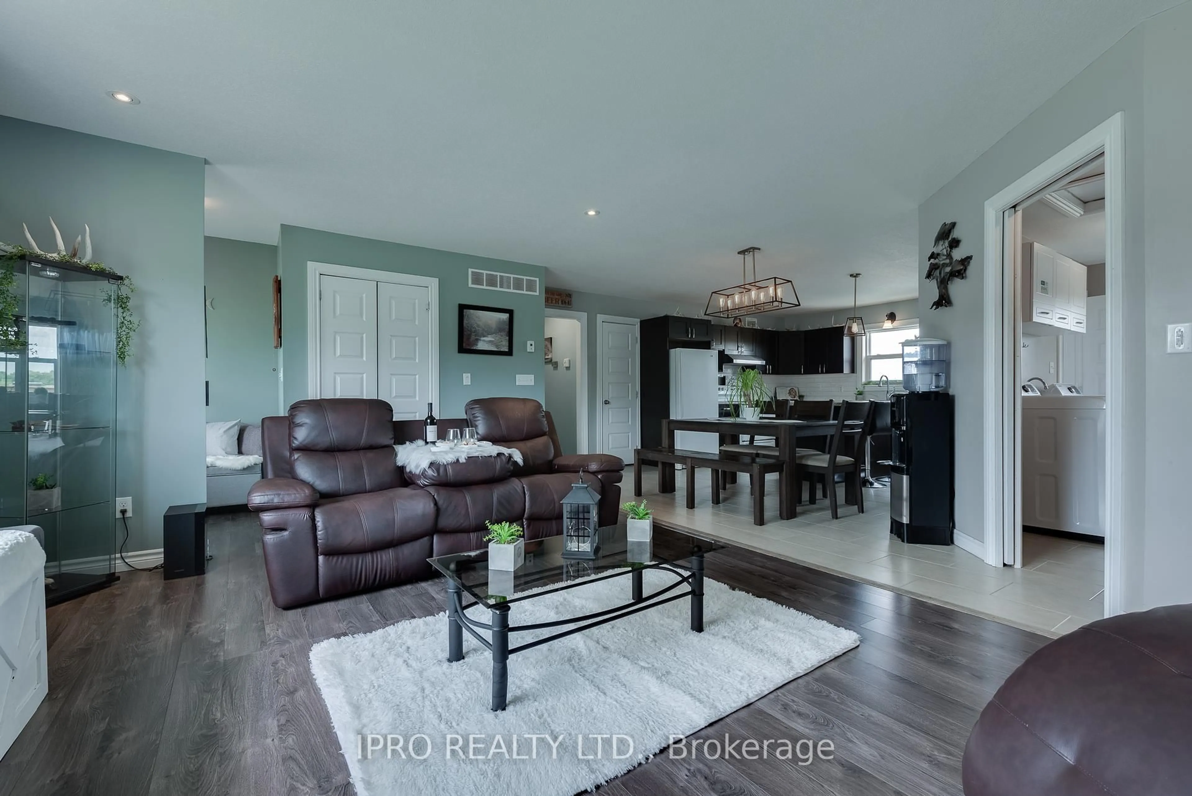 Living room with furniture, wood/laminate floor for 8961 Wellington Road 16 N/A, Wellington North Ontario N0G 2E0