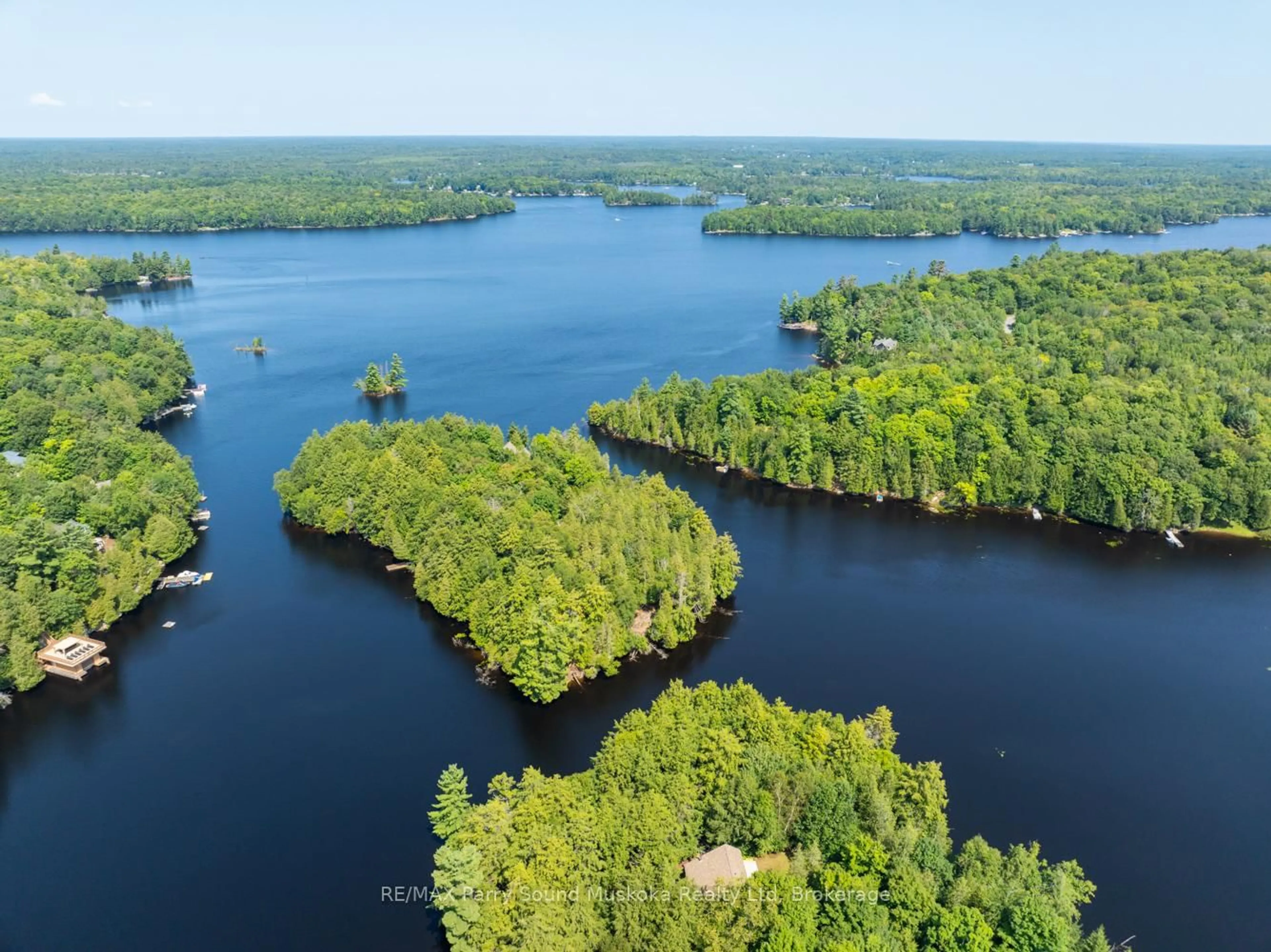 A pic from outside/outdoor area/front of a property/back of a property/a pic from drone, water/lake/river/ocean view for 18 MEHARG Dr, McKellar Ontario P2A 0B5
