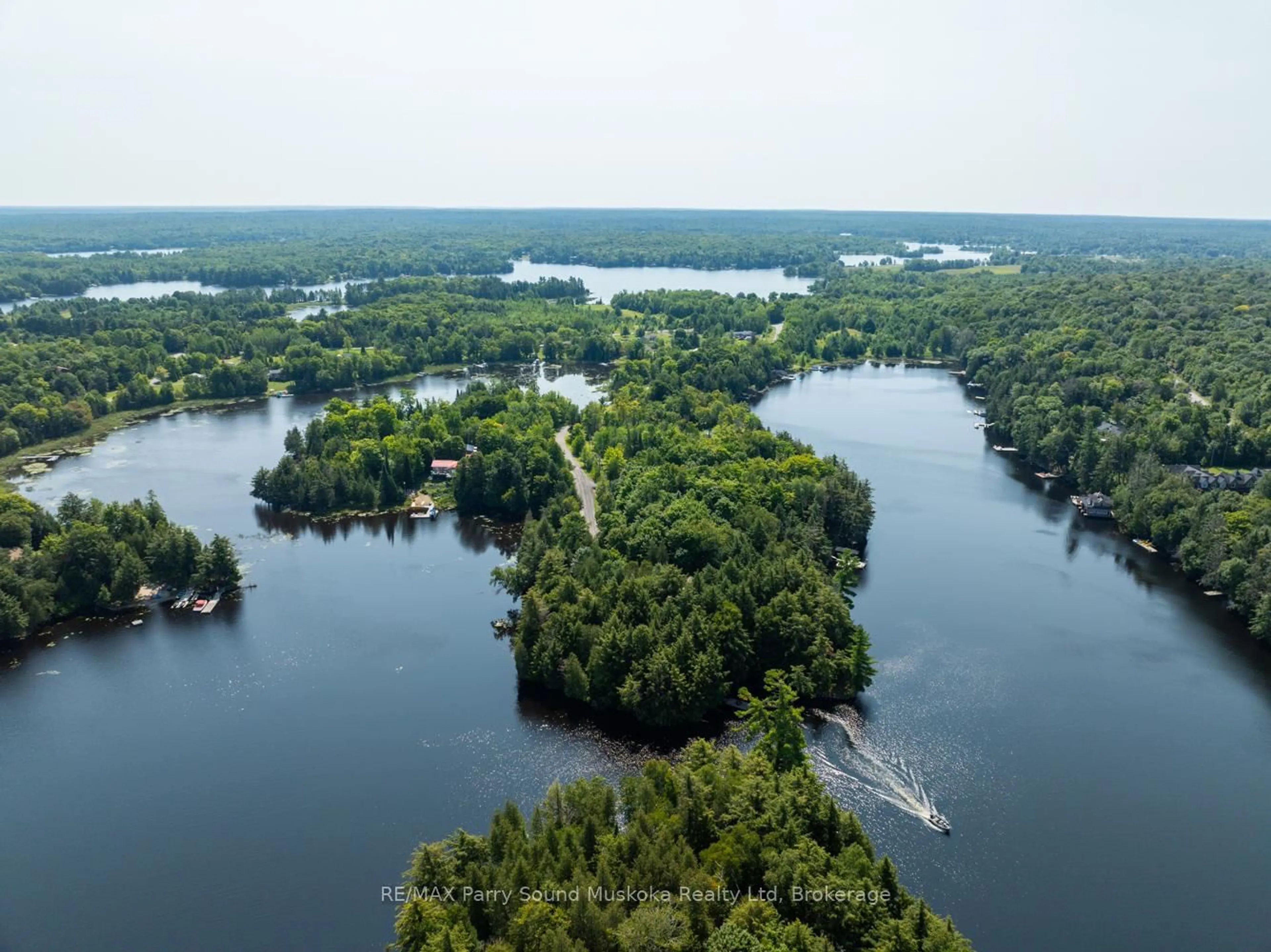 A pic from outside/outdoor area/front of a property/back of a property/a pic from drone, water/lake/river/ocean view for 18 MEHARG Dr, McKellar Ontario P2A 0B5