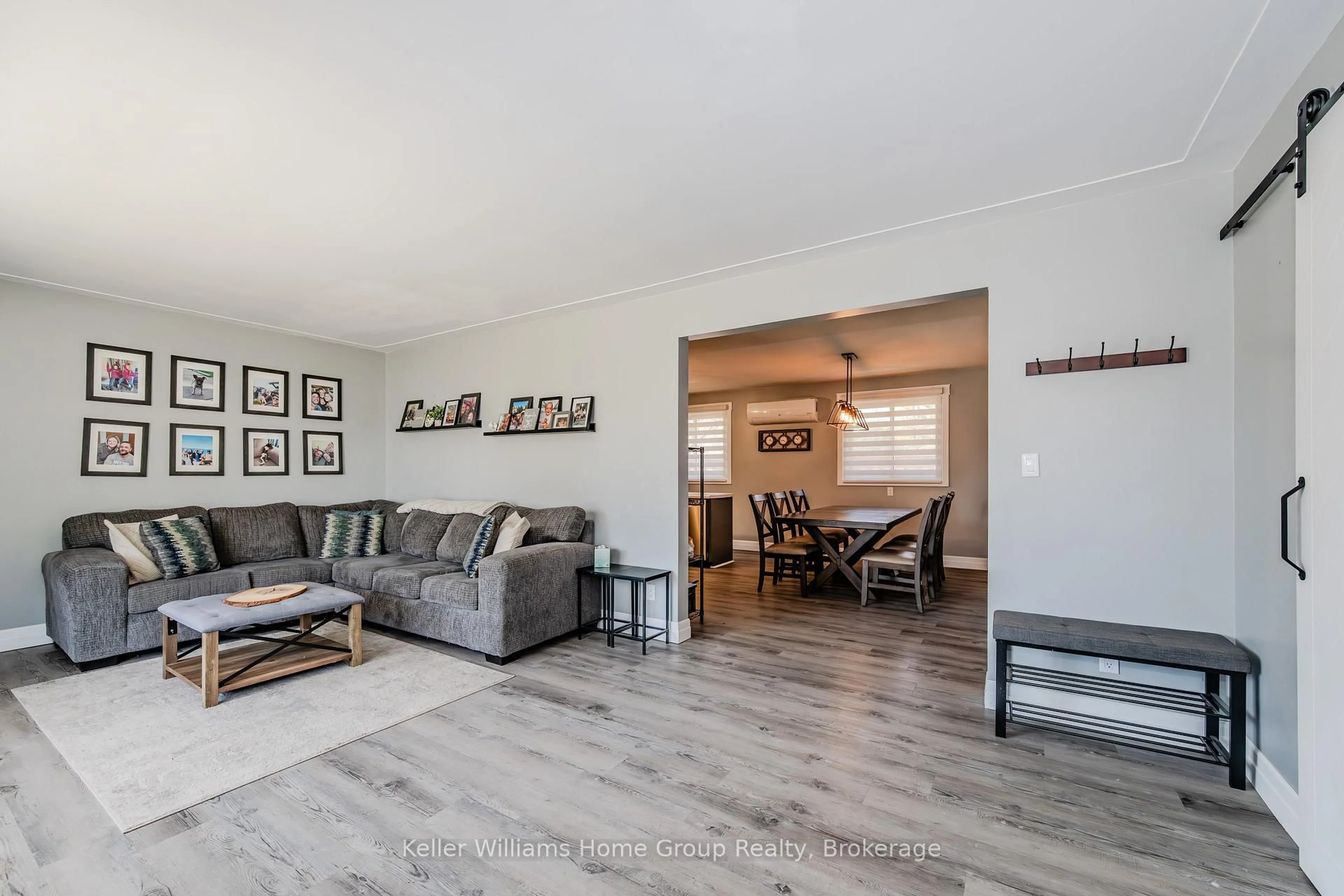 Living room with furniture, wood/laminate floor for 135 LILLICO Ave, North Perth Ontario N4W 2L4