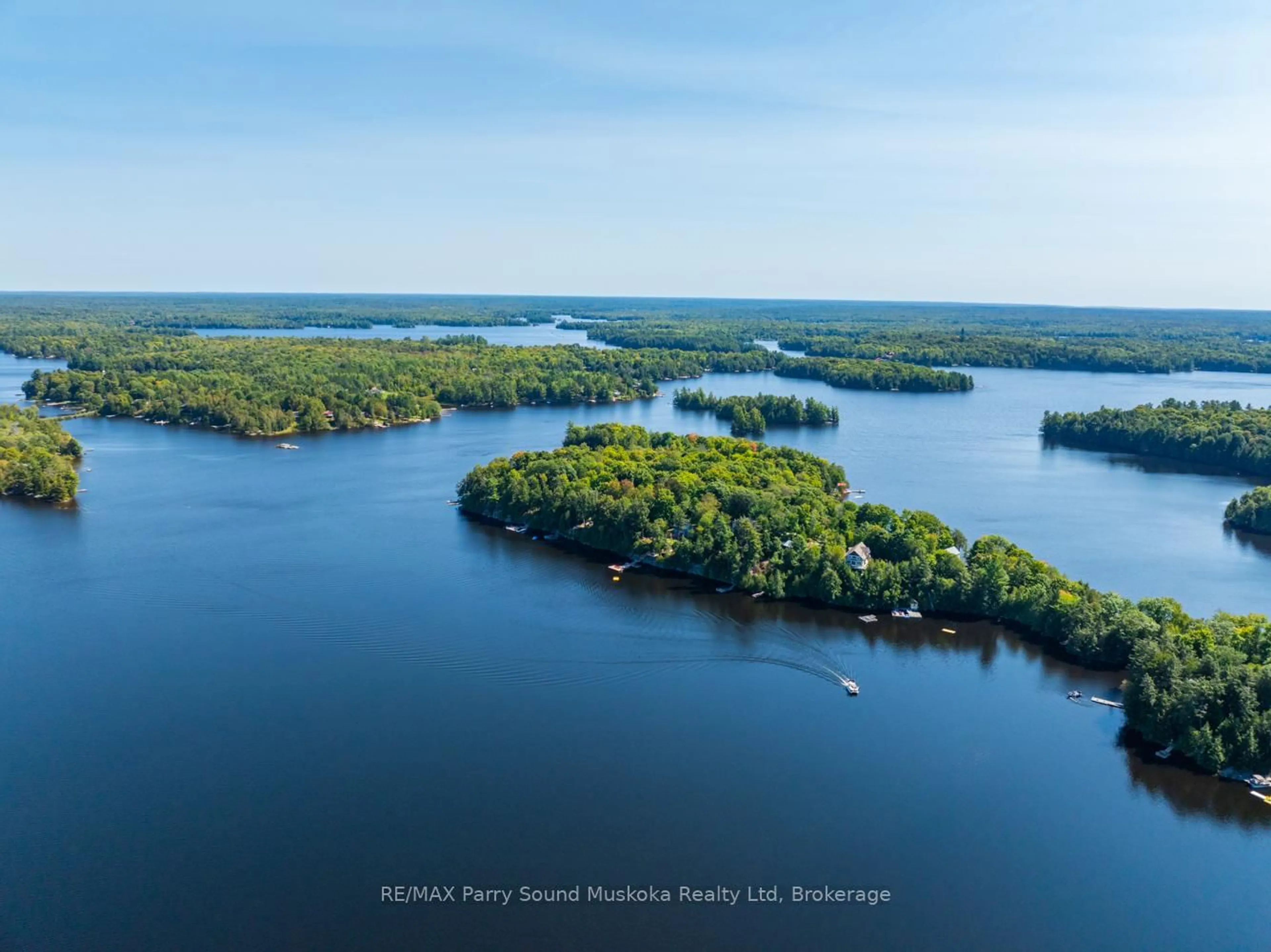 A pic from outside/outdoor area/front of a property/back of a property/a pic from drone, water/lake/river/ocean view for 58 DEERFIELD Rd, McKellar Ontario P2A 0B4