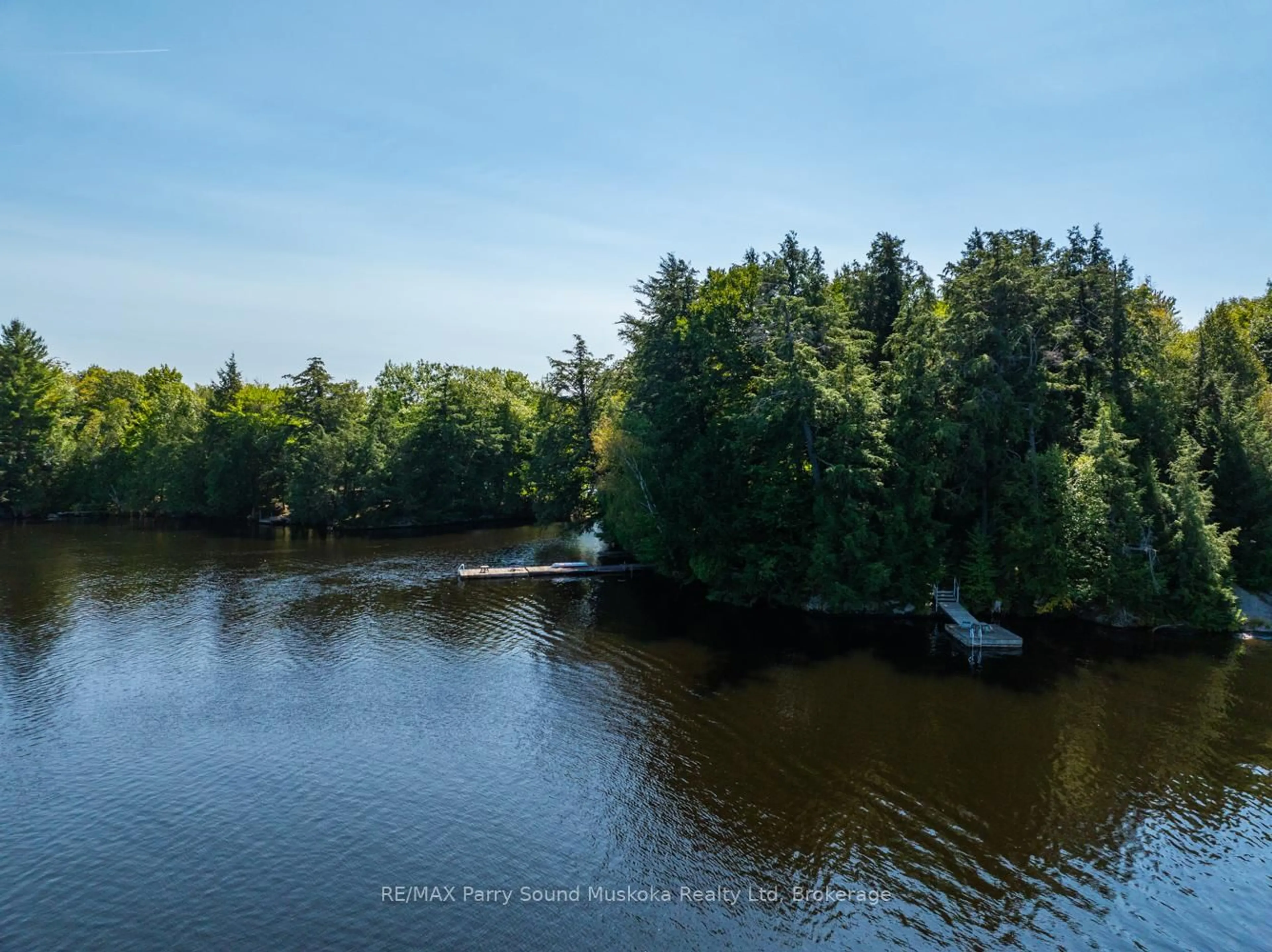 A pic from outside/outdoor area/front of a property/back of a property/a pic from drone, water/lake/river/ocean view for 58 DEERFIELD Rd, McKellar Ontario P2A 0B4