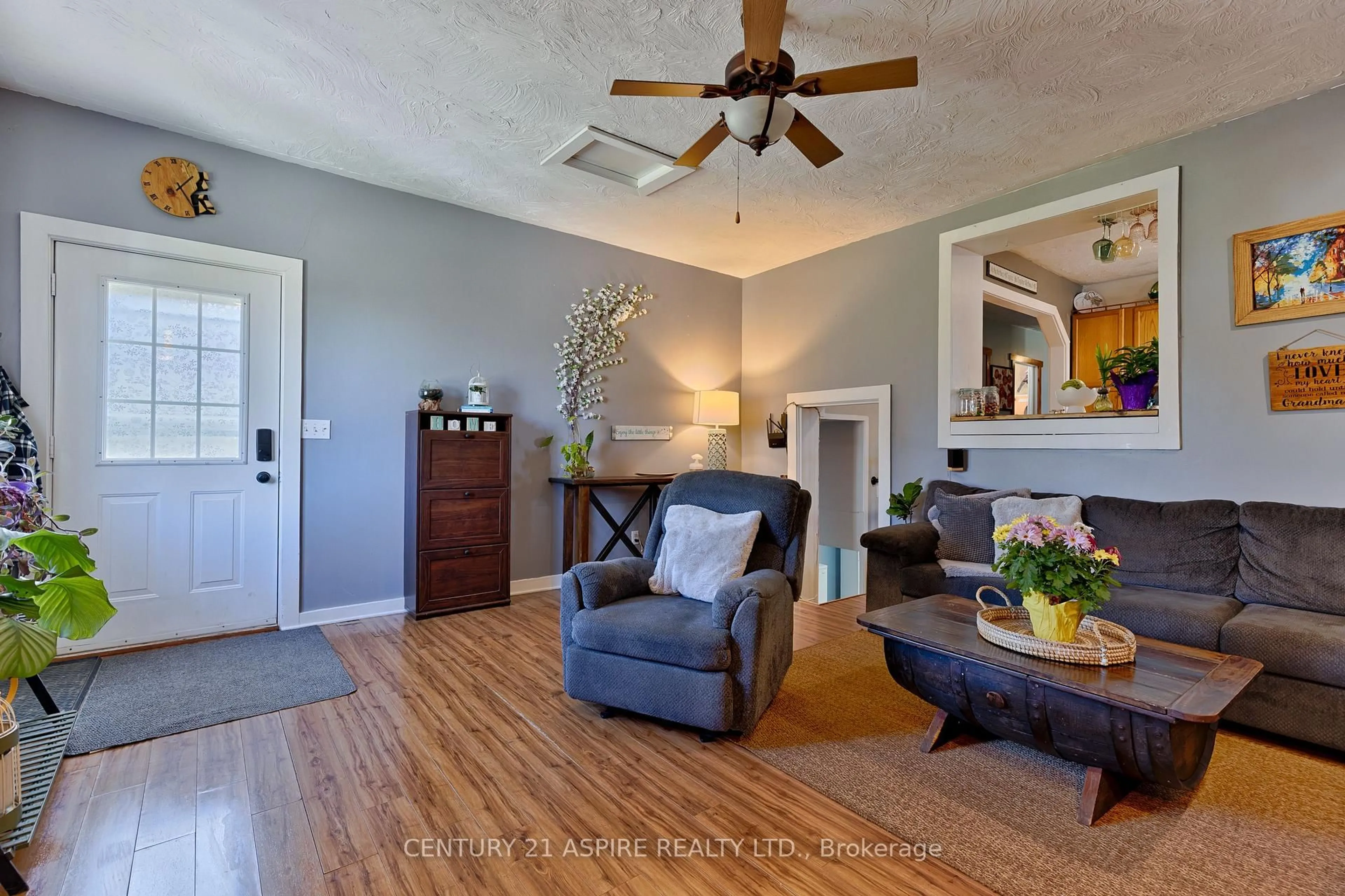 Living room with furniture, wood/laminate floor for 109 Golf Course Rd, Pembroke Ontario K8A 7B1