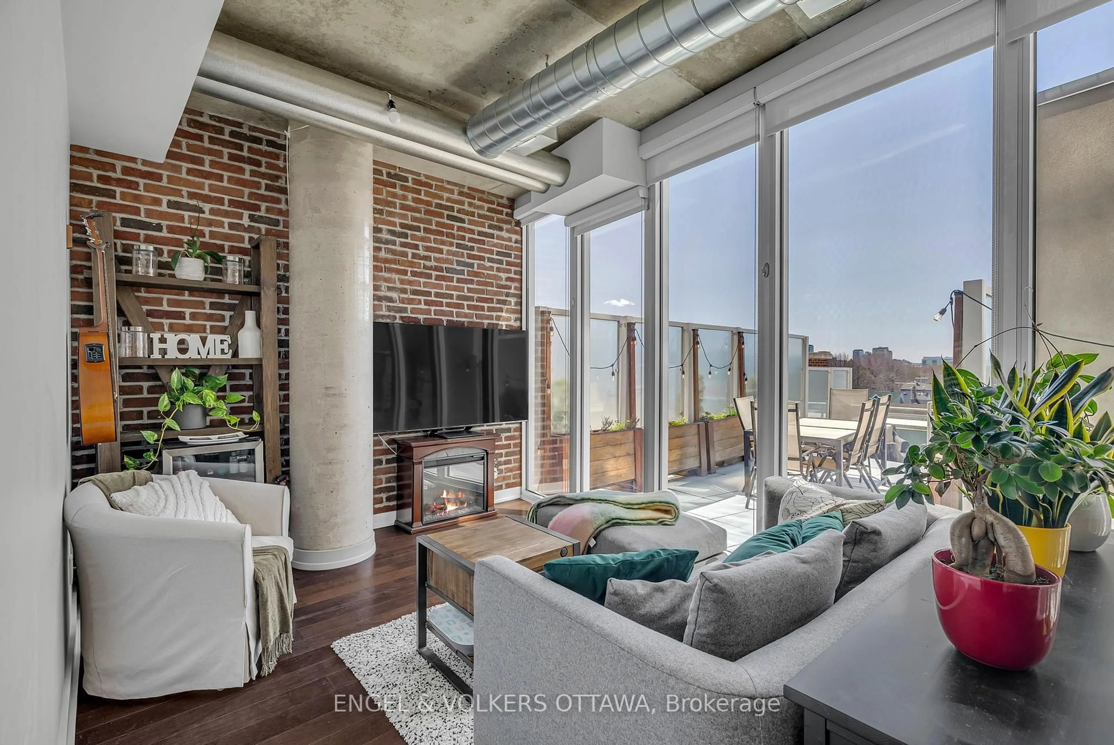 Living room with furniture, cement floor for 354 Gladstone Ave #407, Ottawa Ontario K2P 0R4