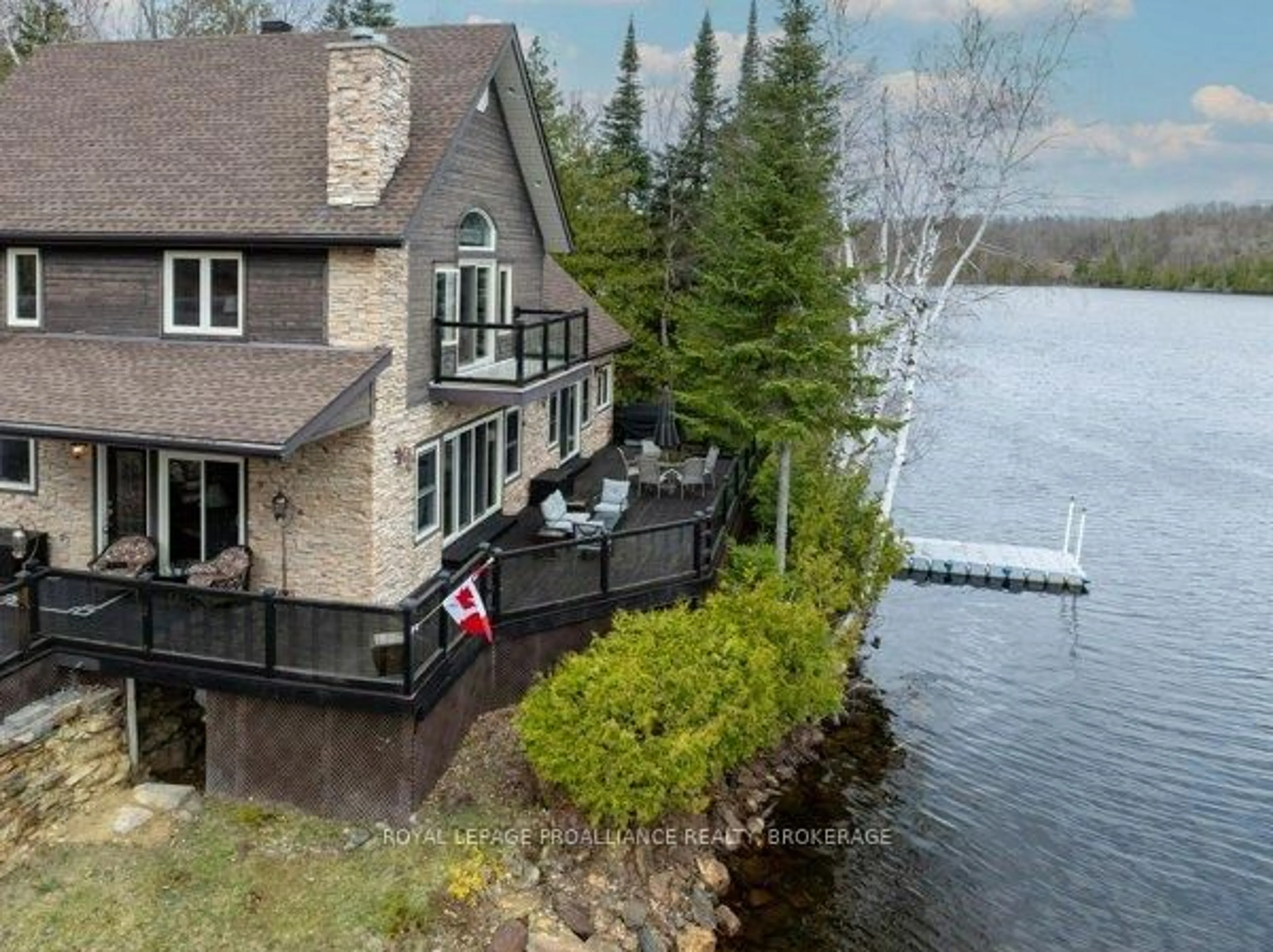 A pic from outside/outdoor area/front of a property/back of a property/a pic from drone, water/lake/river/ocean view for 2000 Brewer Rd, Sharbot Lake Ontario K0H 2P0