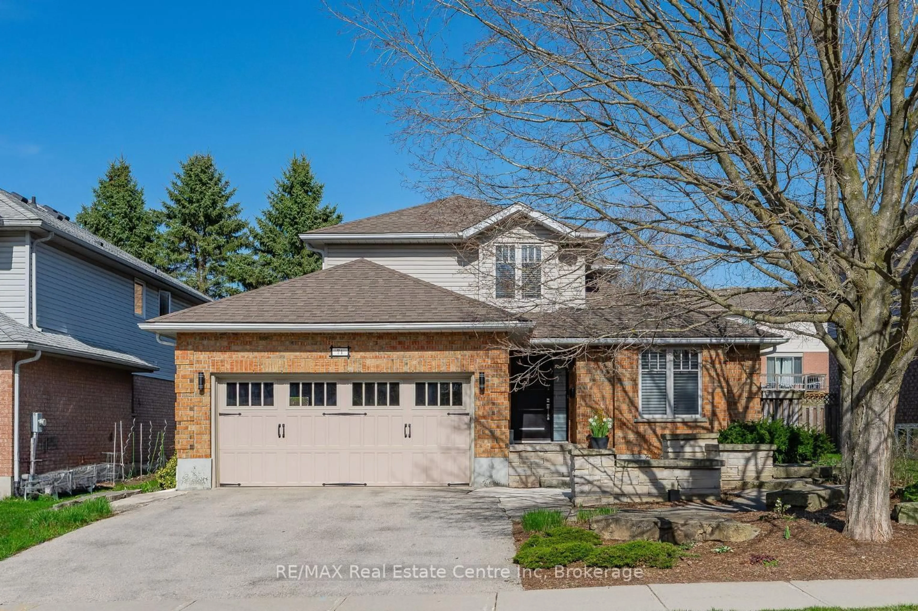Home with brick exterior material, street for 71 PTARMIGAN Dr, Guelph Ontario N1C 1B6