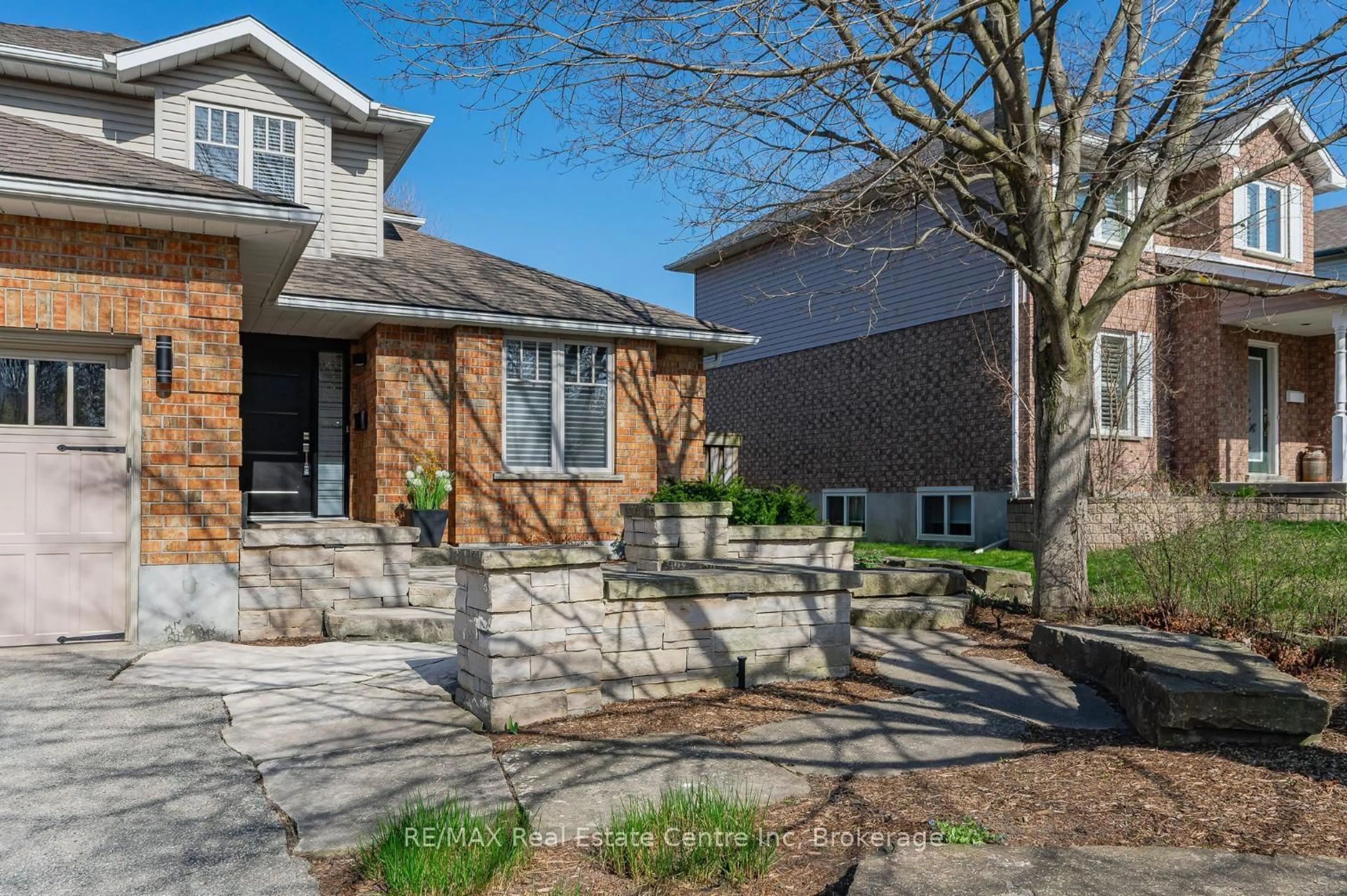 Home with brick exterior material, street for 71 PTARMIGAN Dr, Guelph Ontario N1C 1B6