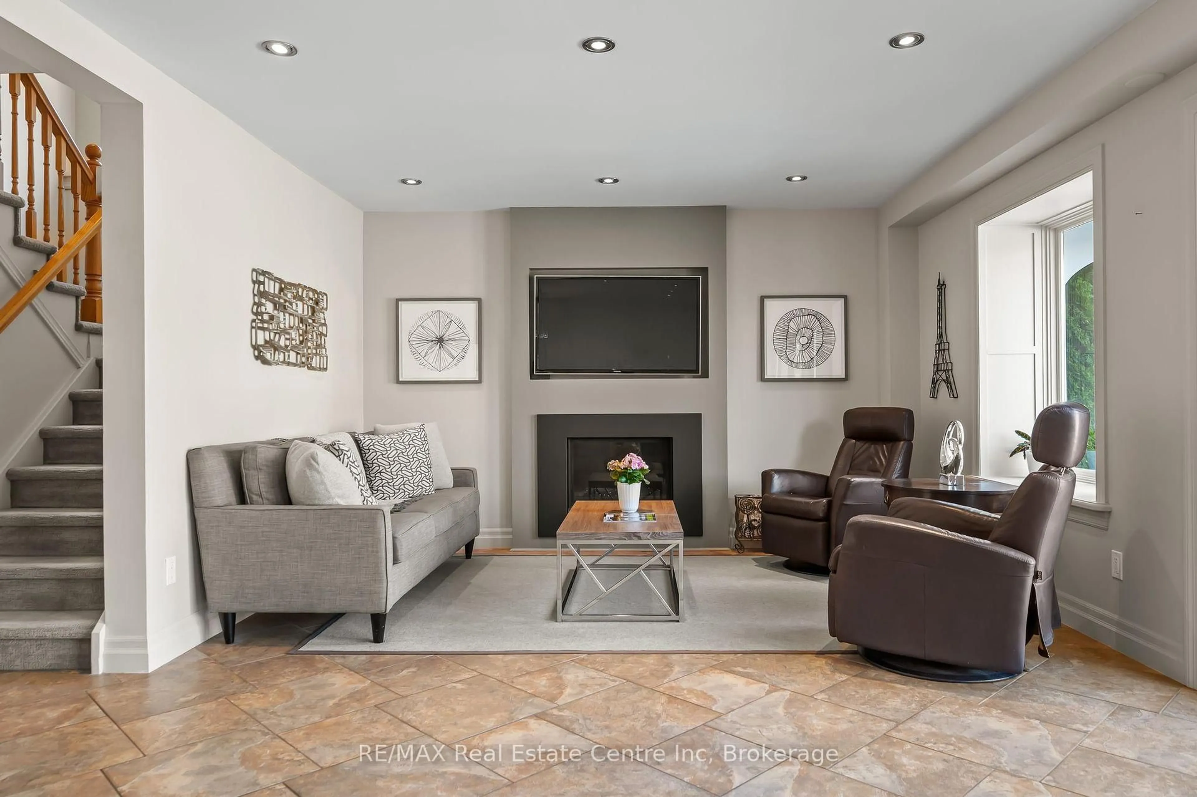 Living room with furniture, ceramic/tile floor for 71 PTARMIGAN Dr, Guelph Ontario N1C 1B6
