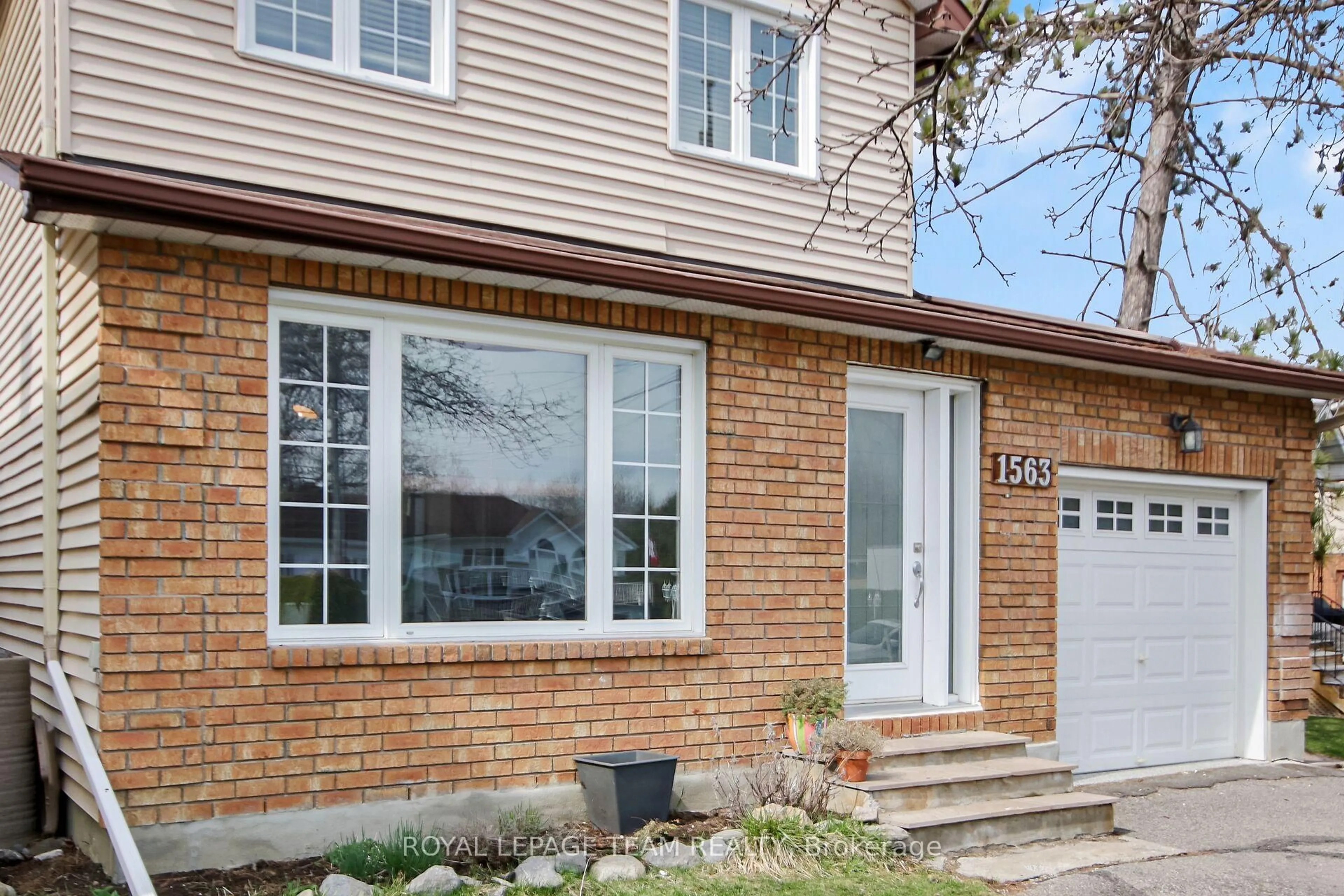 Home with brick exterior material, street for 1563 Goth Ave, Ottawa Ontario K1T 1E3