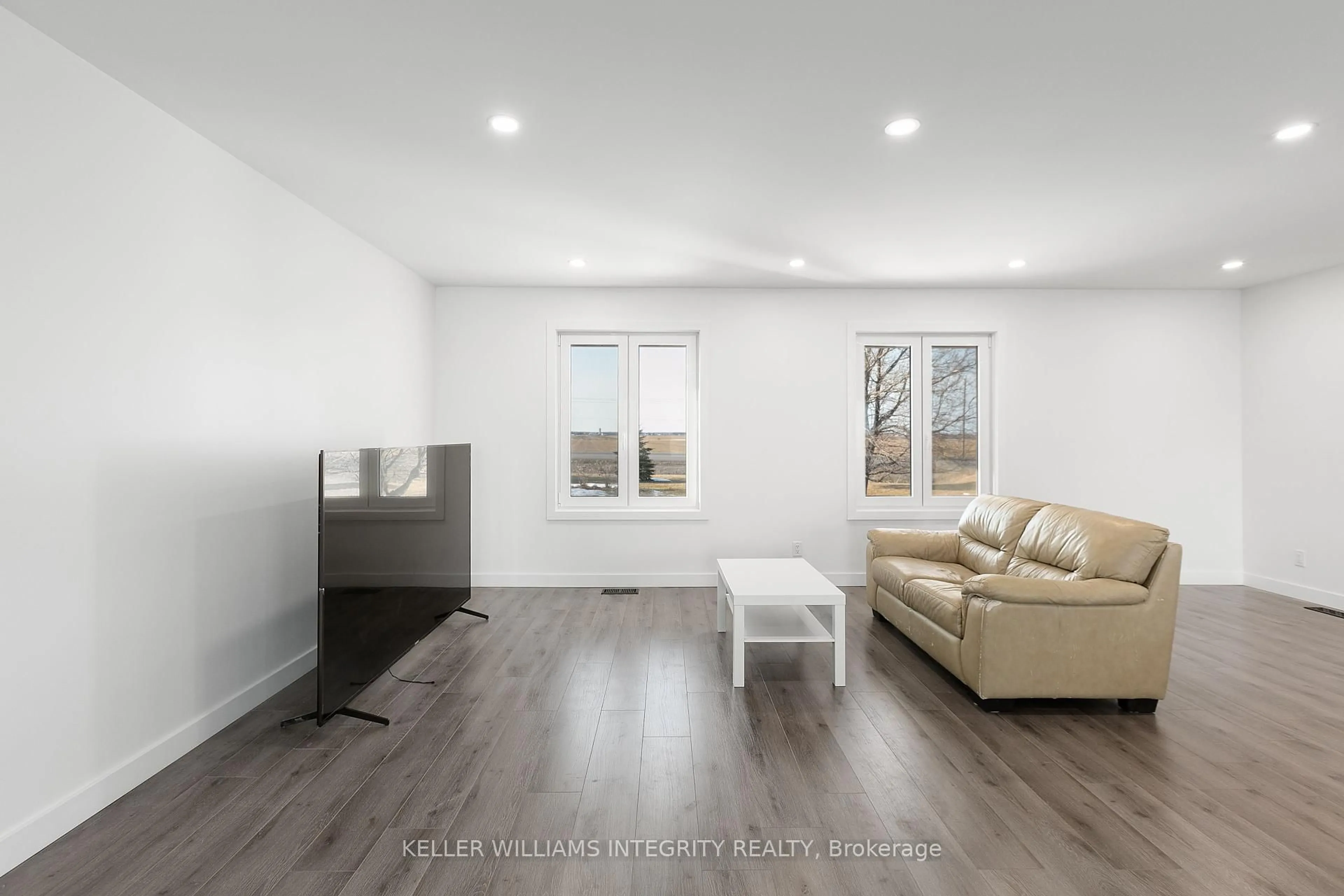Living room with furniture, wood/laminate floor for 2140 COUNTY RD 8 Rd, The Nation Ontario K0A 1M0