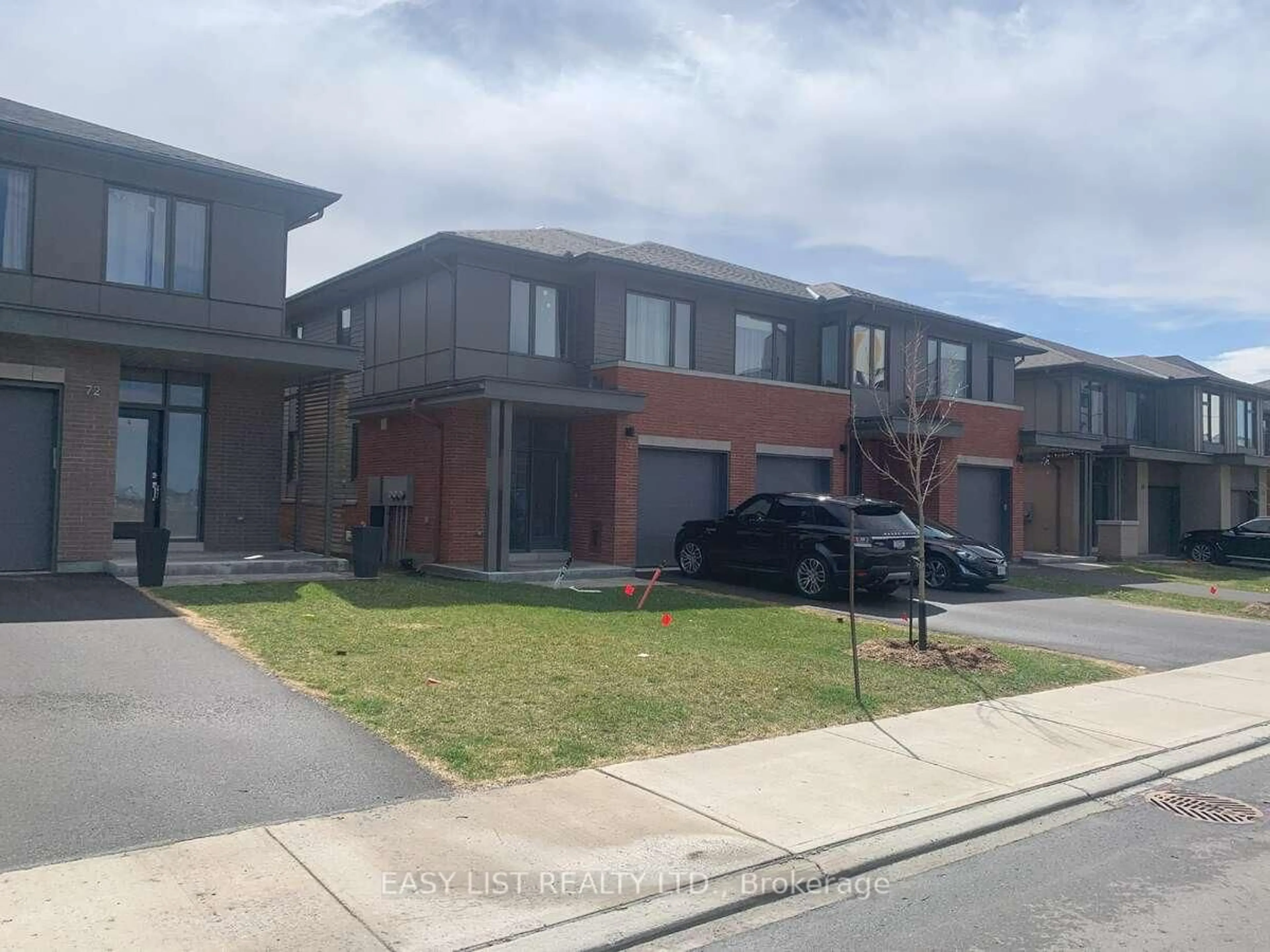 A pic from outside/outdoor area/front of a property/back of a property/a pic from drone, street for 74 Michael Stoqua St, Ottawa Ontario K1K 5A2