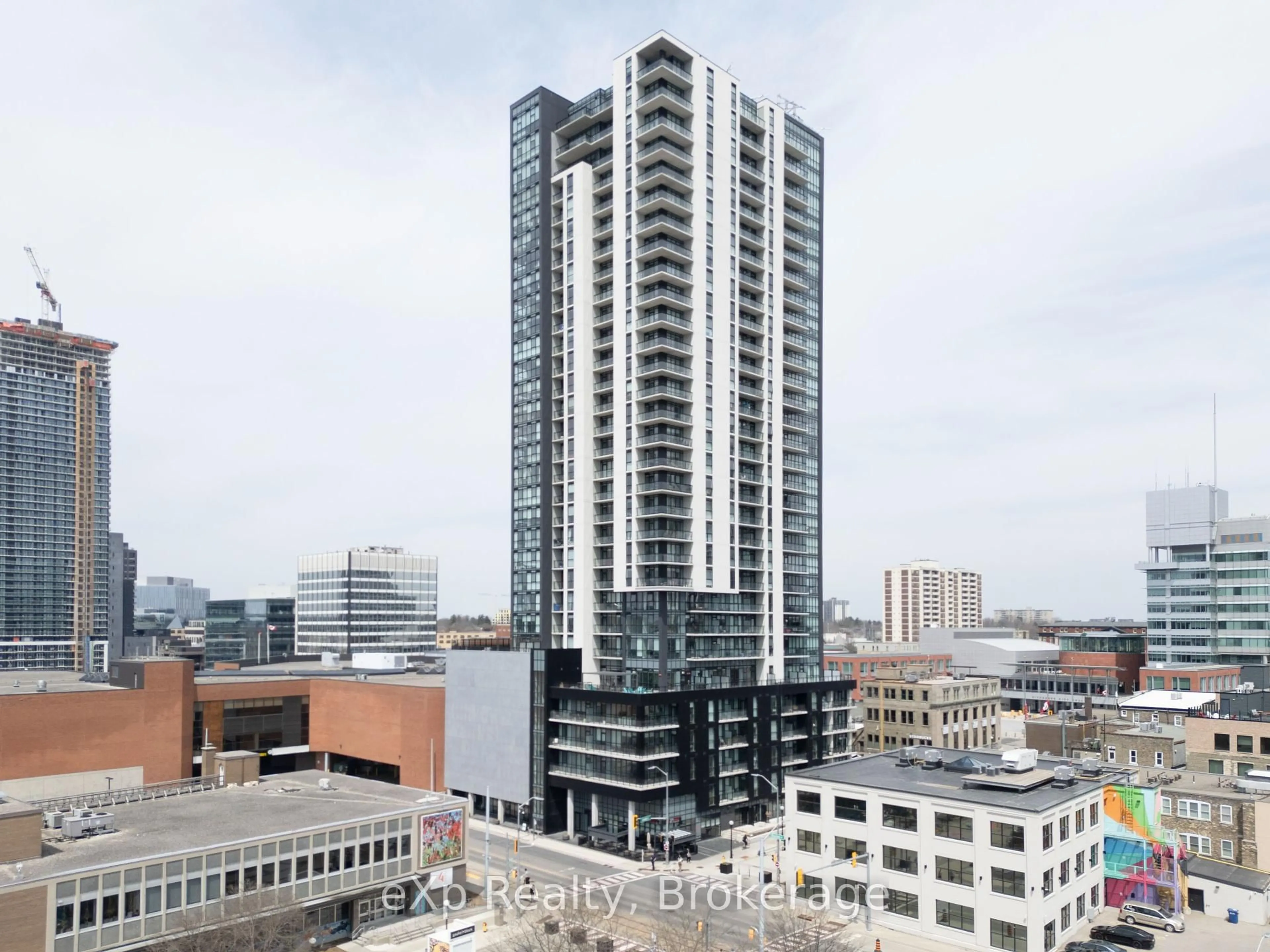 A pic from outside/outdoor area/front of a property/back of a property/a pic from drone, city buildings view from balcony for 60 Charles St #1703, Kitchener Ontario N2G 0C9