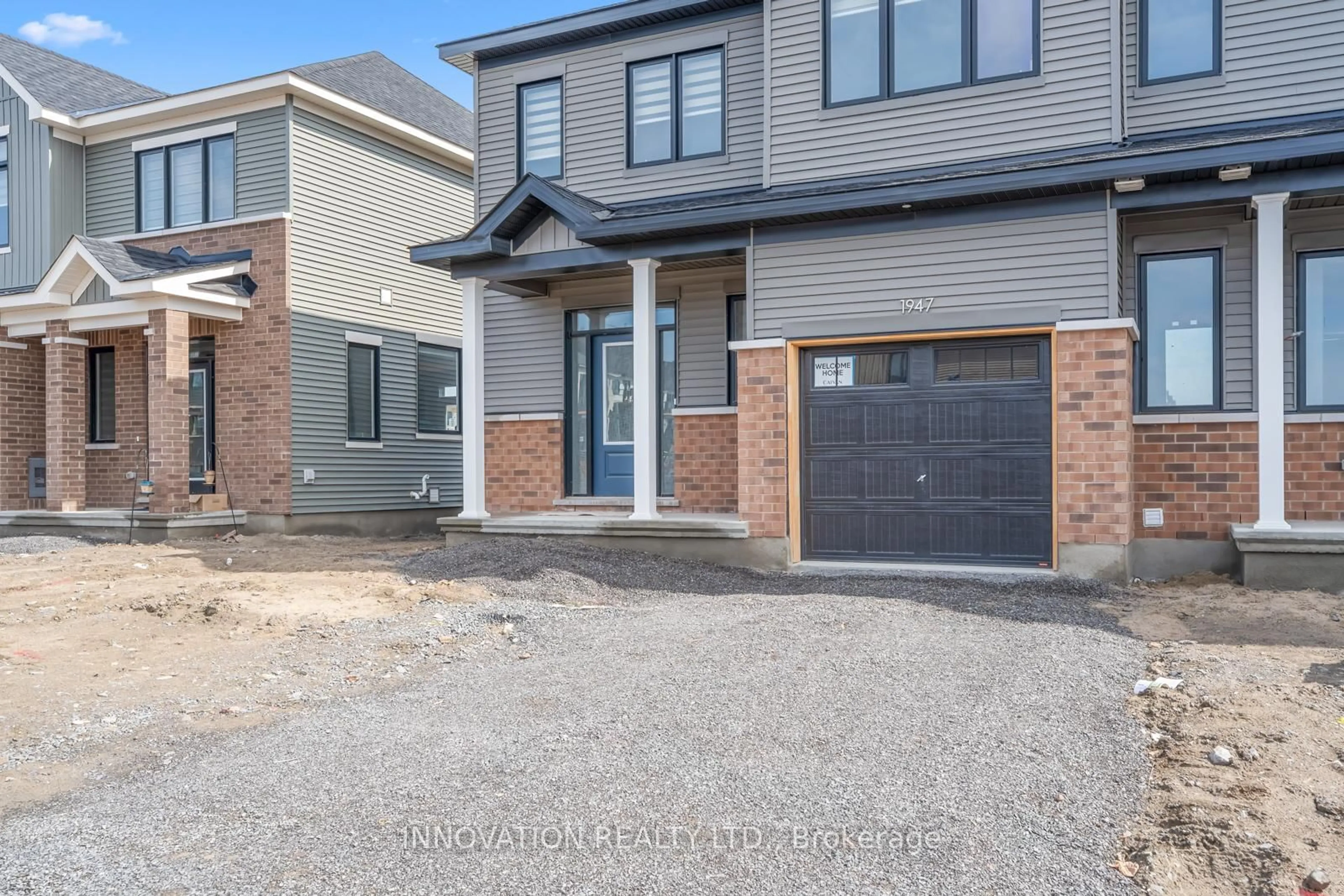 Home with brick exterior material, street for 1947 Elevation Rd, Barrhaven Ontario K2J 7H1