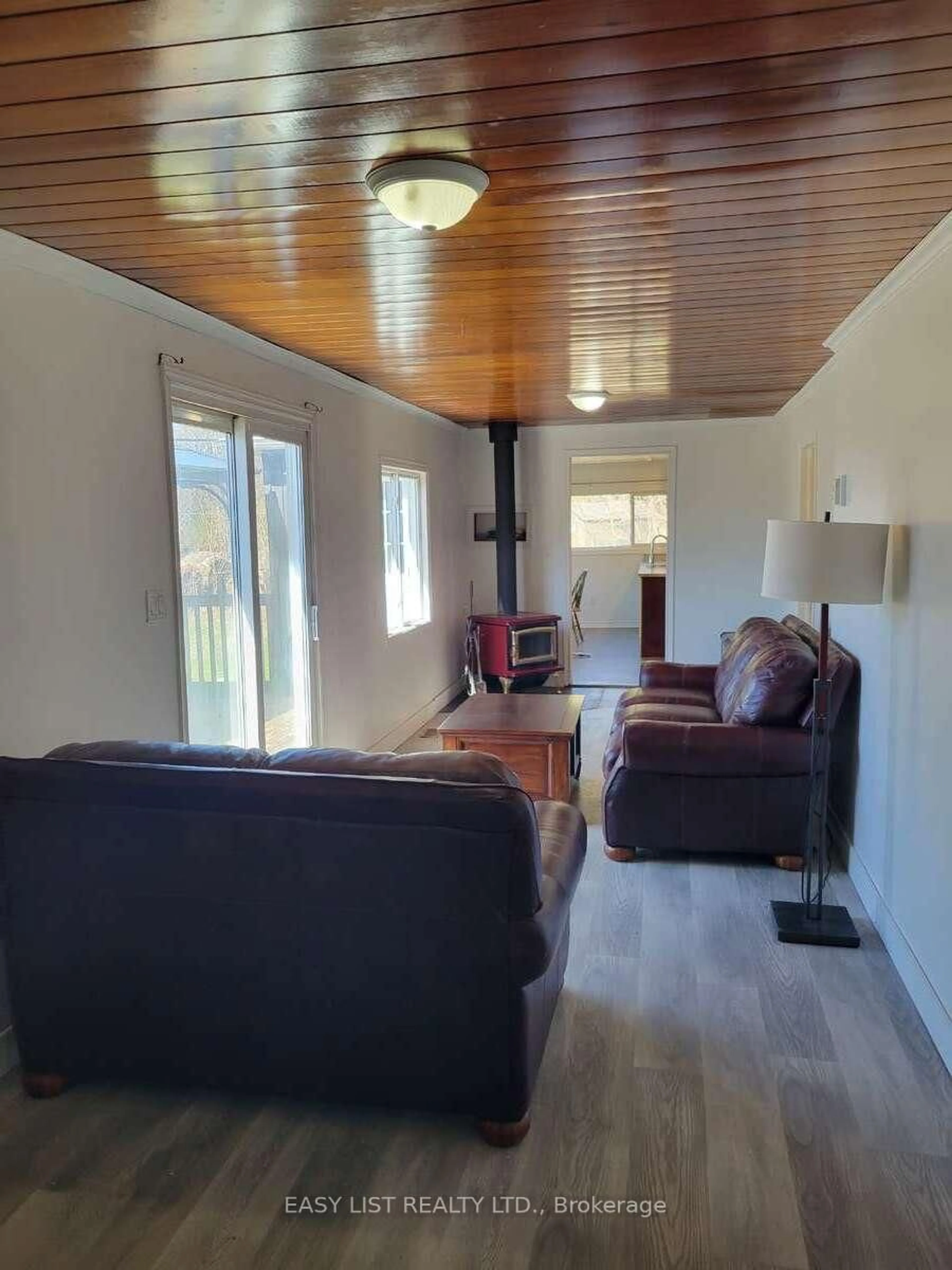 Living room with furniture, wood/laminate floor for 10419 28 N/A, North Kawartha Ontario K0L 1A0