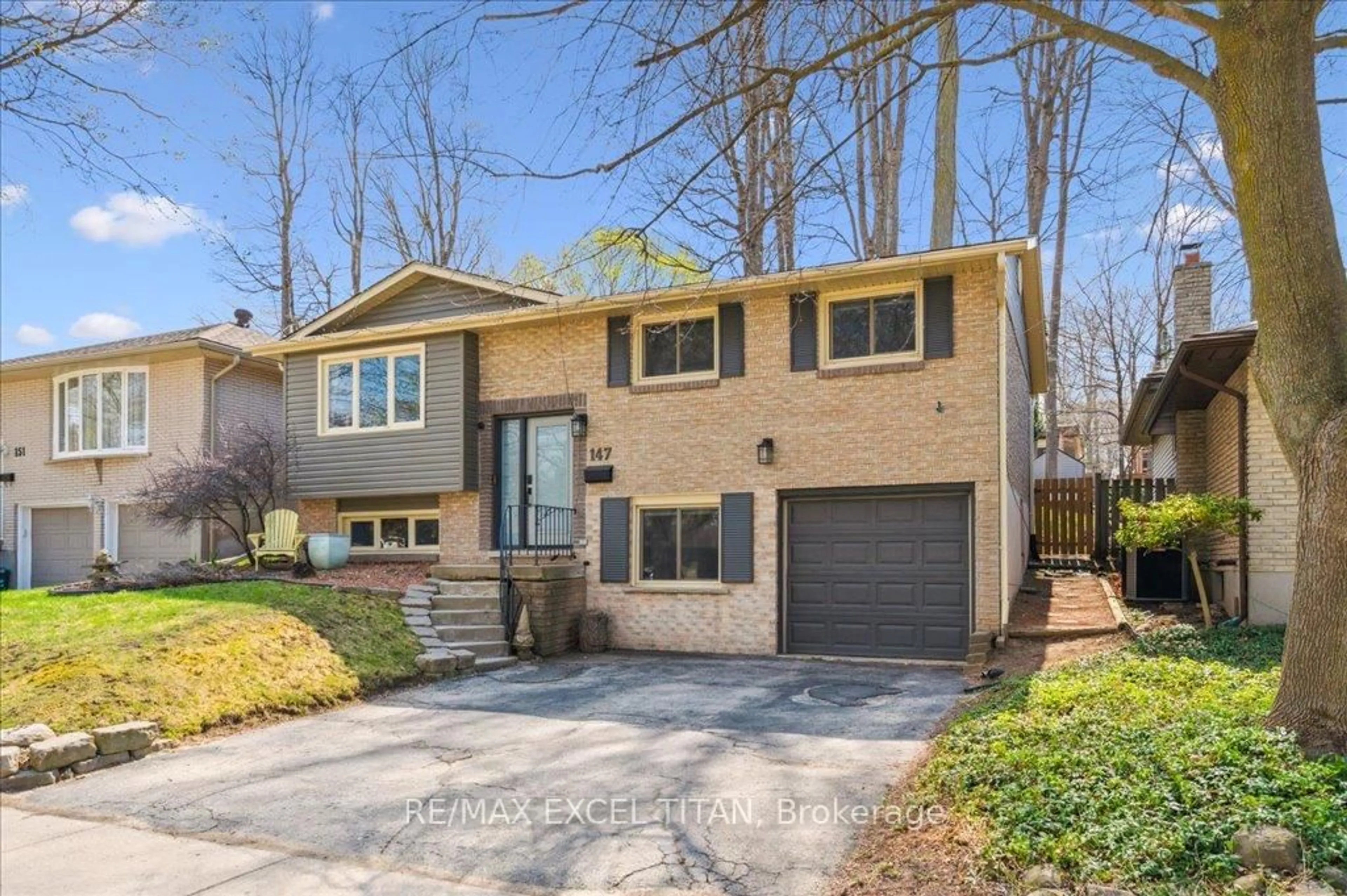 Home with brick exterior material, street for 147 Coach Hill Dr, Kitchener Ontario N2E 1N7