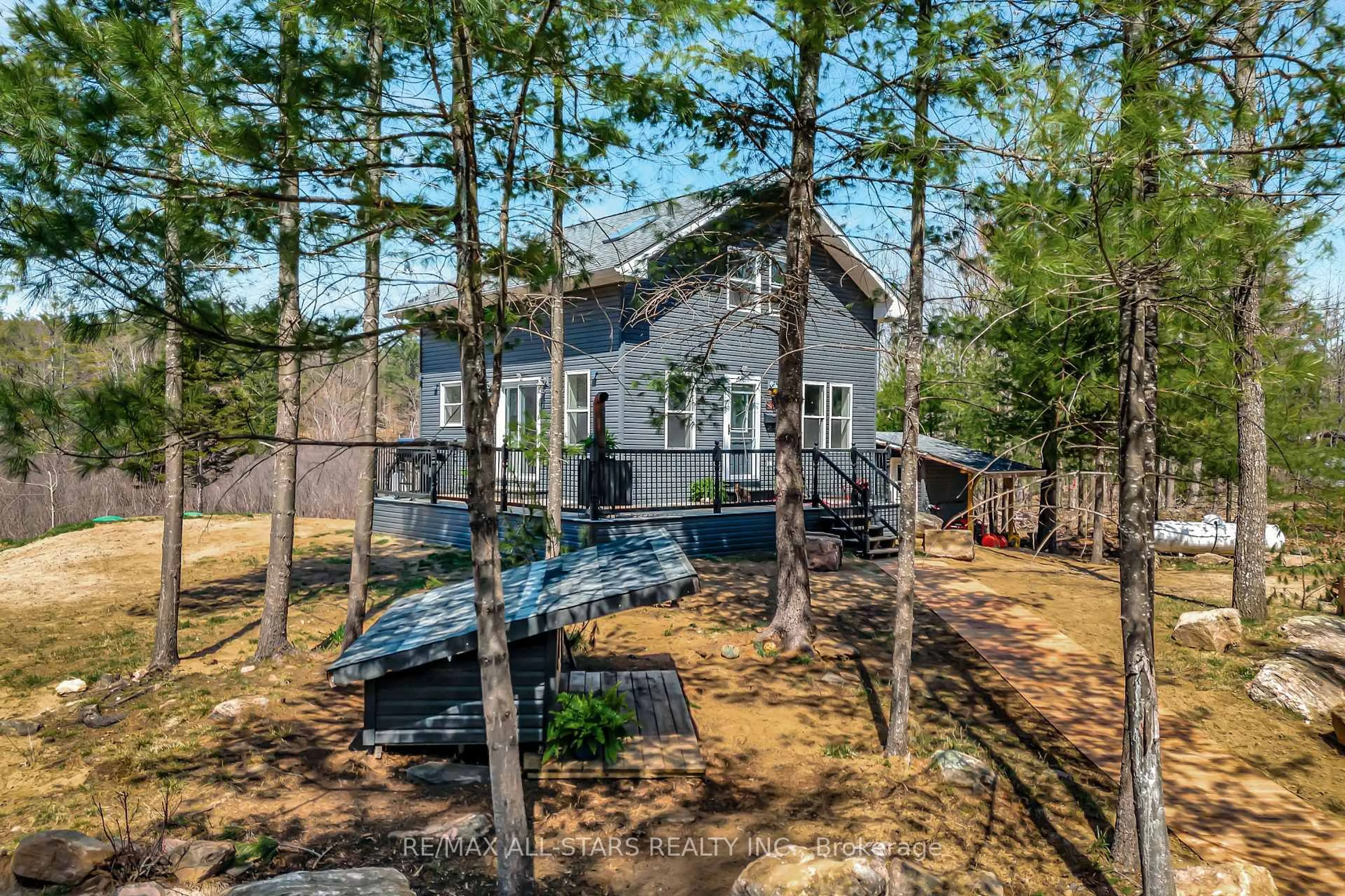 A pic from outside/outdoor area/front of a property/back of a property/a pic from drone, unknown for 1295 Deep Bay Rd, Minden Hills Ontario K0M 2L0