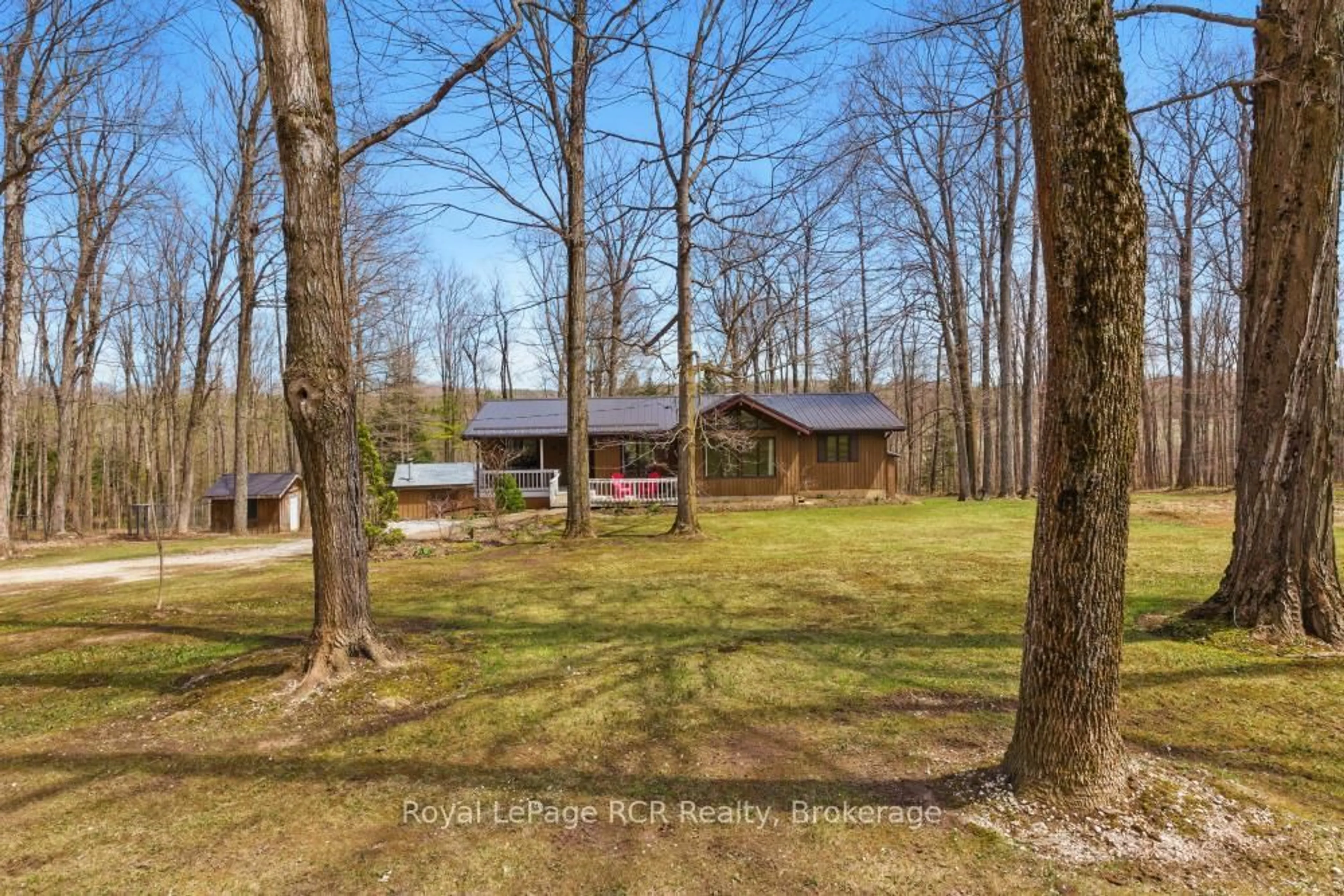 A pic from outside/outdoor area/front of a property/back of a property/a pic from drone, forest/trees view for 214333 Baseline Rd, West Grey Ontario N0G 1S0
