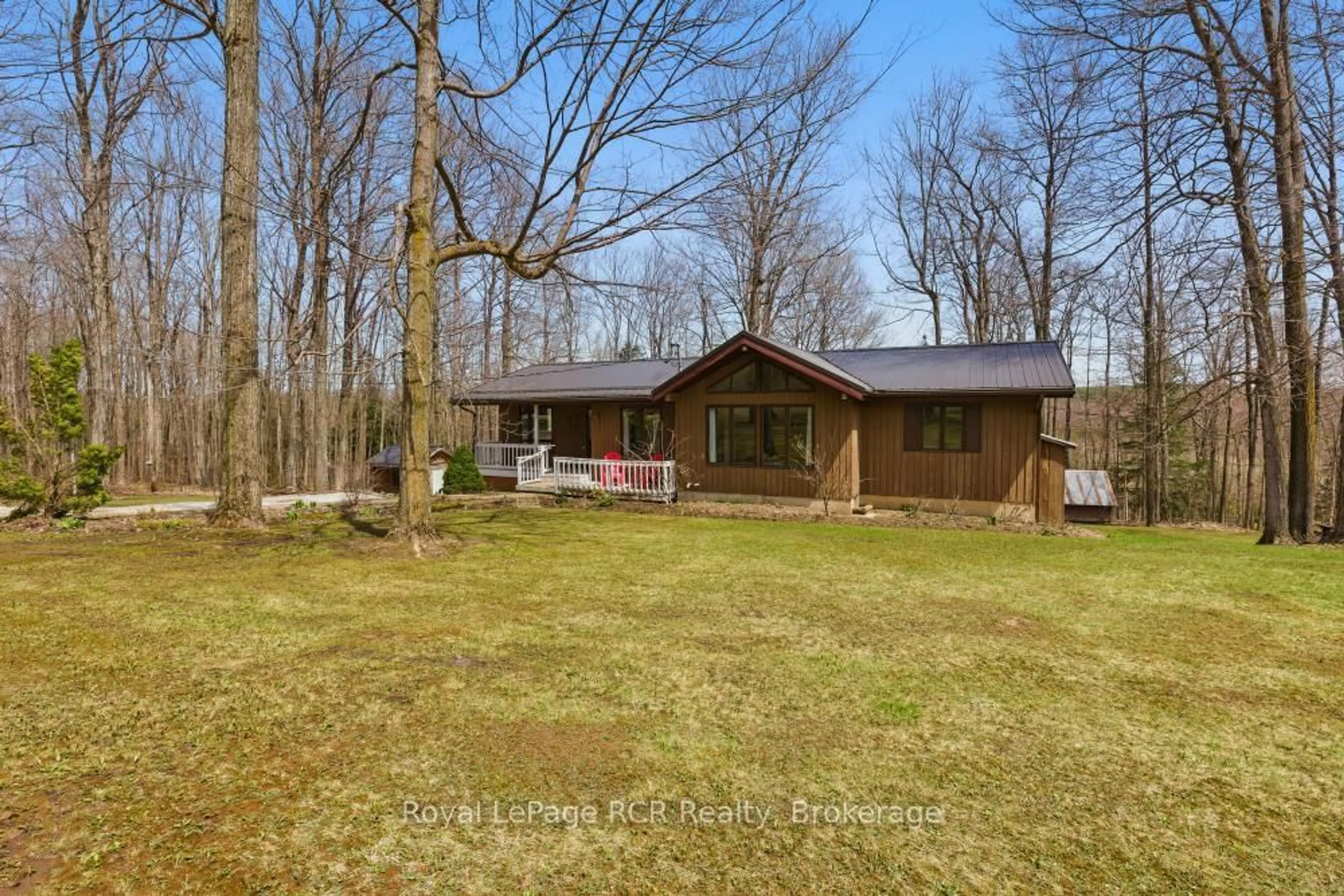 A pic from outside/outdoor area/front of a property/back of a property/a pic from drone, forest/trees view for 214333 Baseline Rd, West Grey Ontario N0G 1S0
