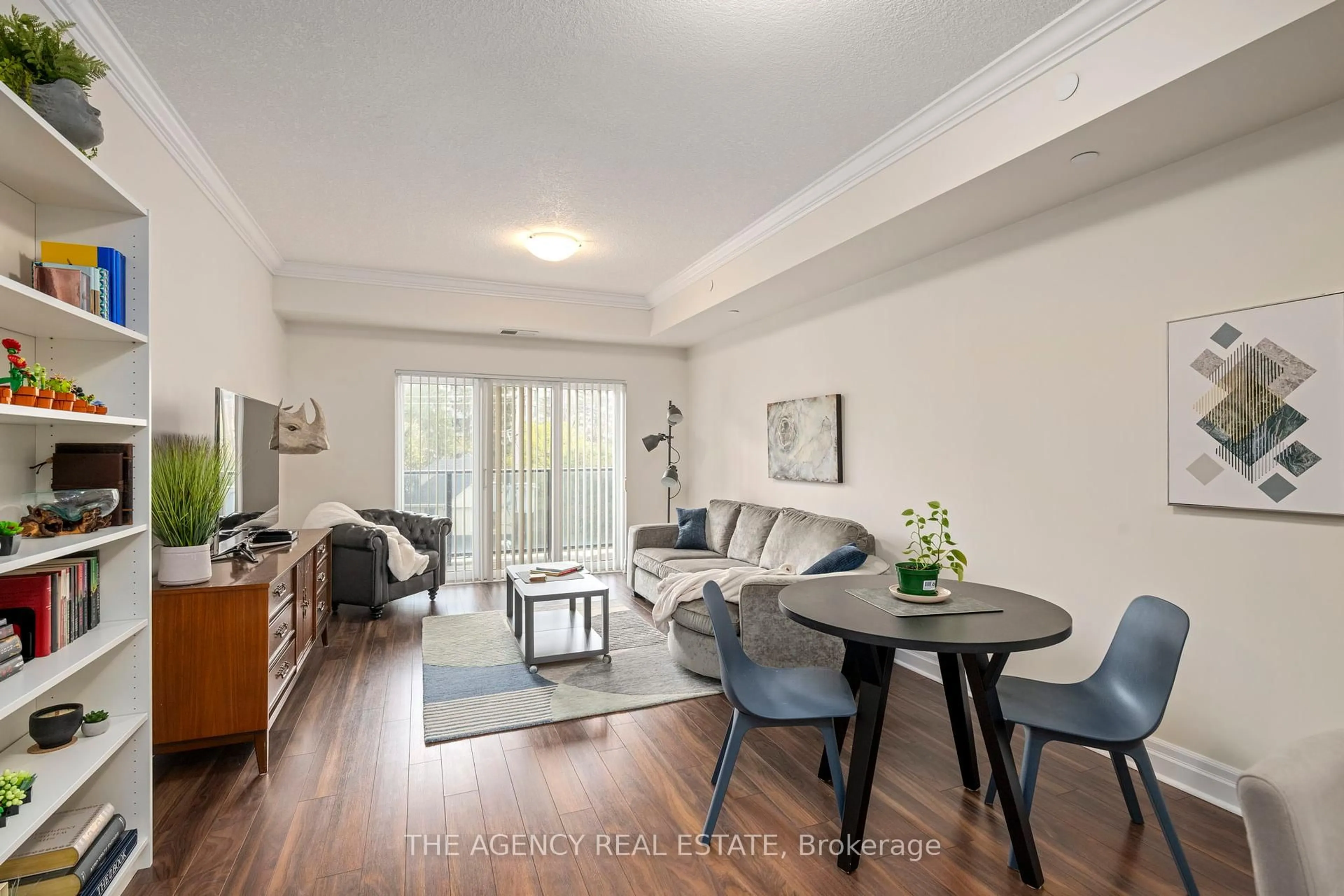Living room with furniture, wood/laminate floor for 89 Ridout St #403, London South Ontario N6C 3X2