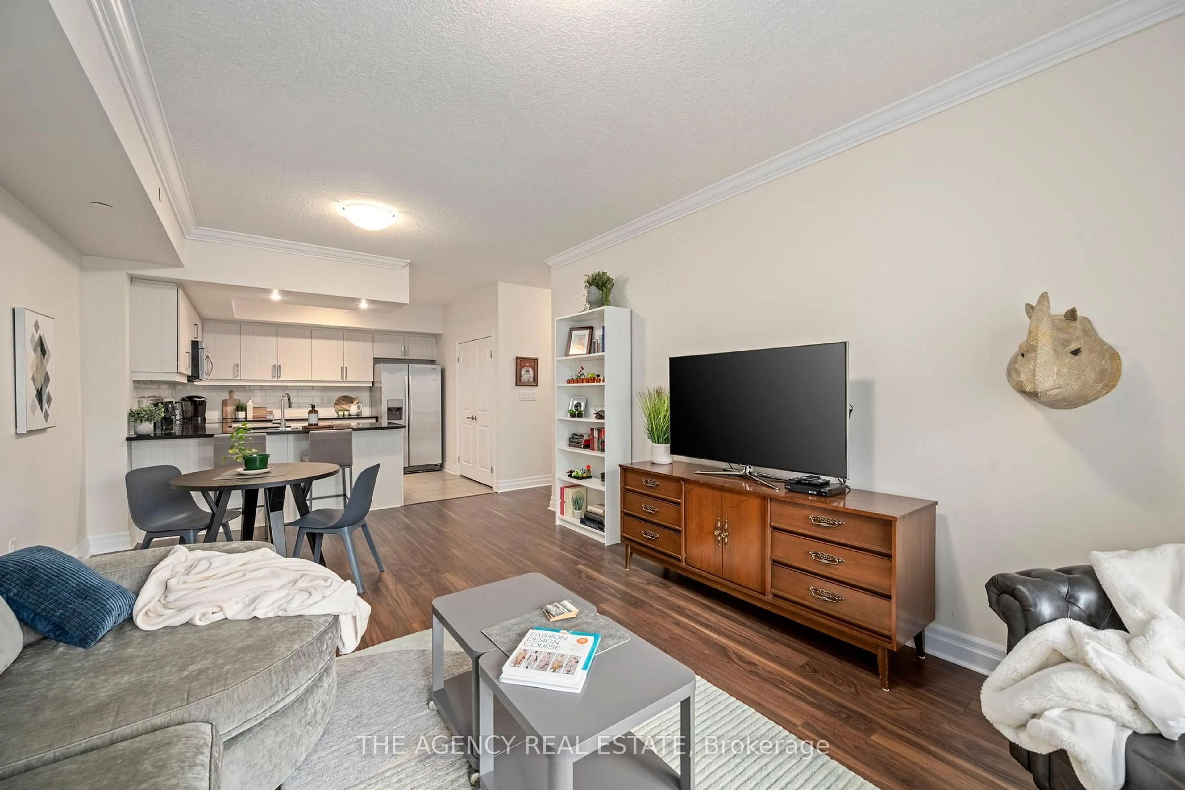 Living room with furniture, wood/laminate floor for 89 Ridout St #403, London South Ontario N6C 3X2