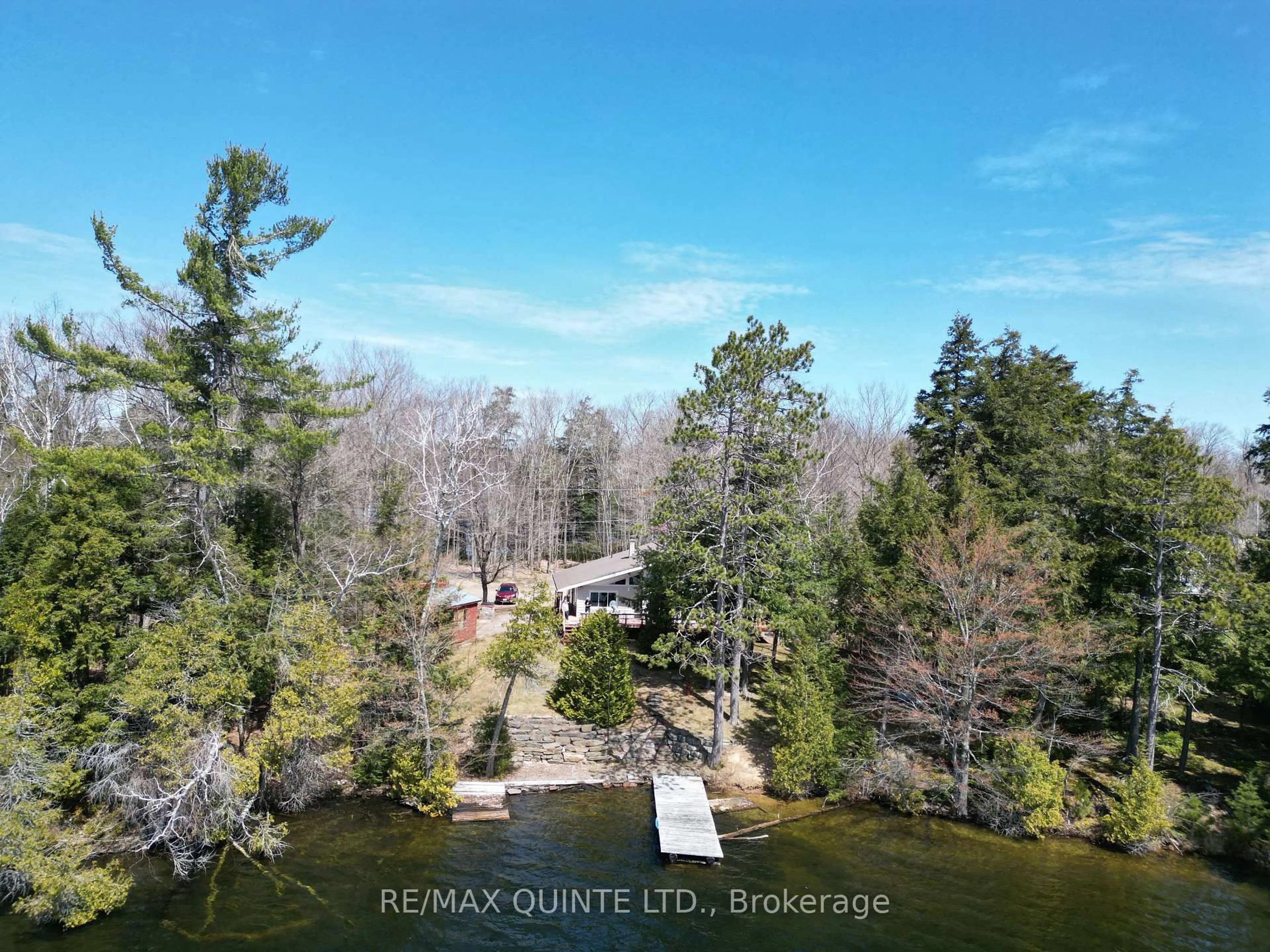 A pic from outside/outdoor area/front of a property/back of a property/a pic from drone, water/lake/river/ocean view for 2309 Grindstone Lake Rd, Plevna Ontario K0H 2M0