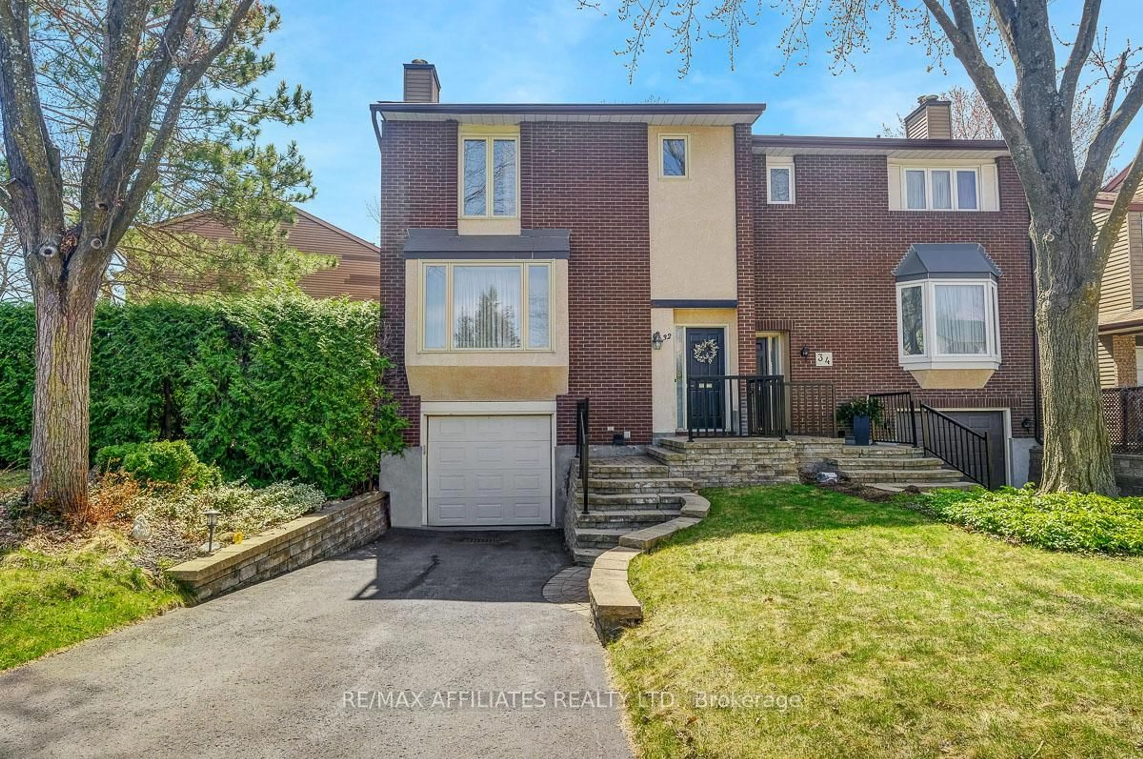 Home with brick exterior material, street for 32 Gillespie Cres, Ottawa Ontario K1V 9X8