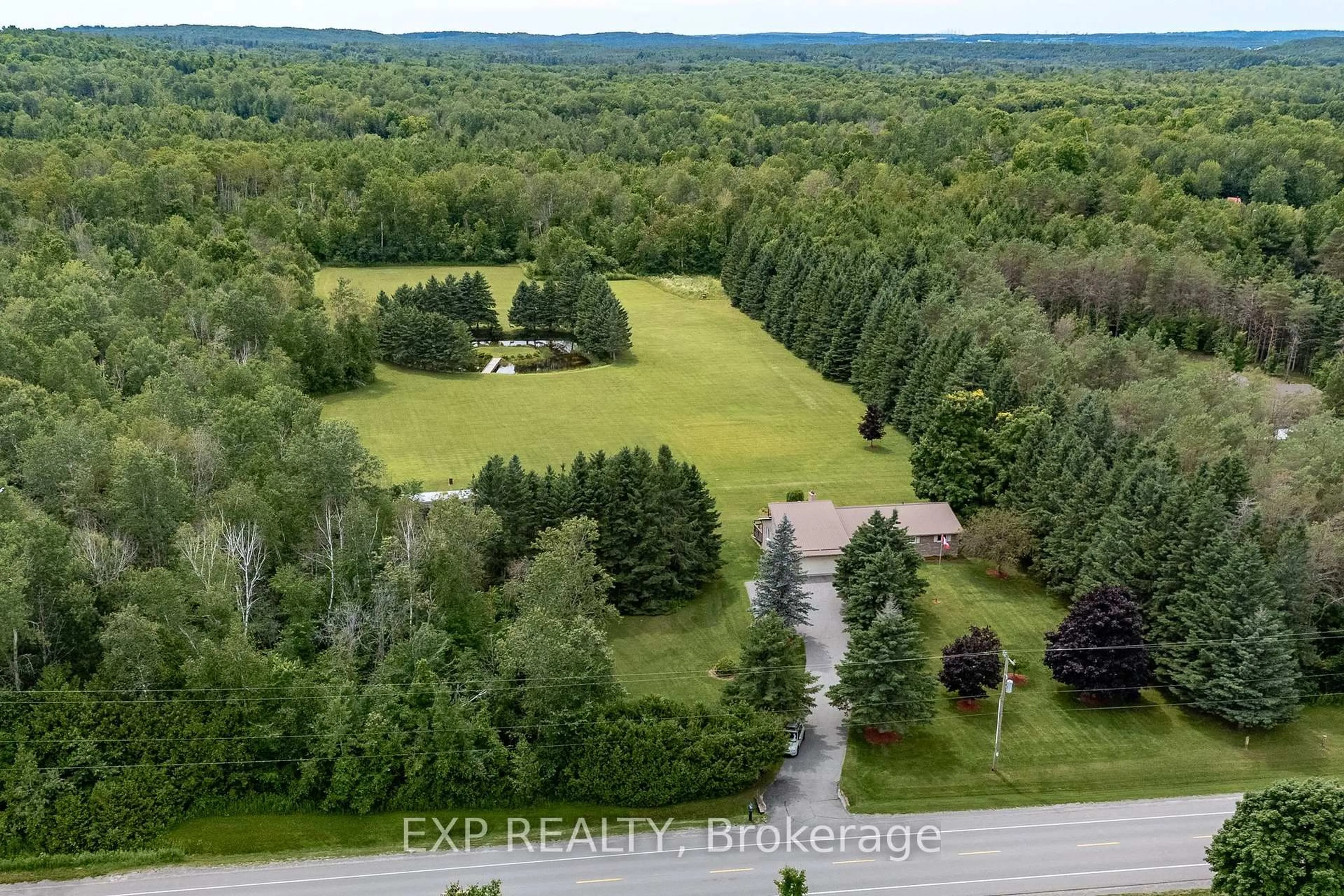 A pic from outside/outdoor area/front of a property/back of a property/a pic from drone, forest/trees view for 2106 County Road 30 Rd, Brighton Ontario K0K 1H0