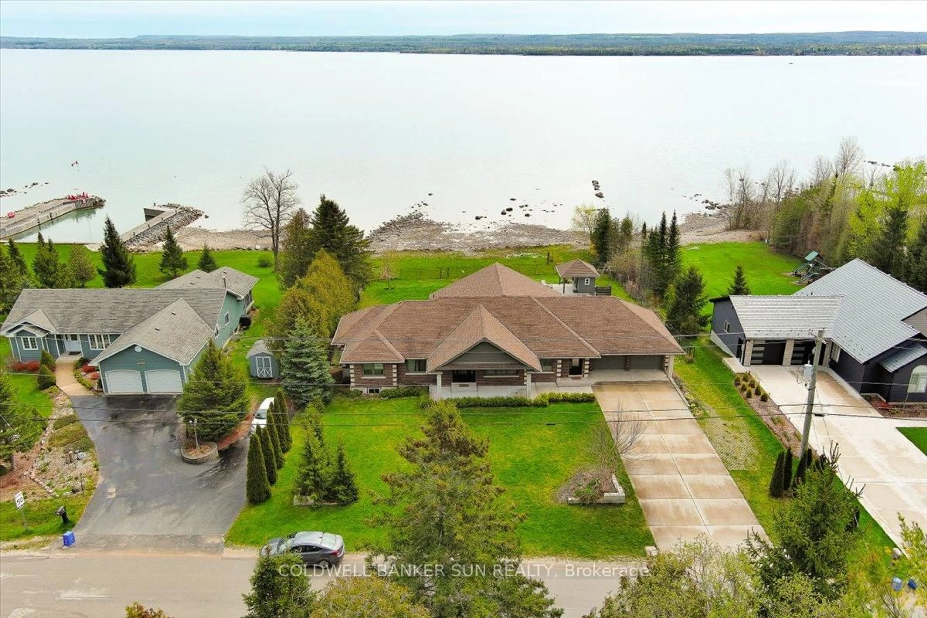 A pic from outside/outdoor area/front of a property/back of a property/a pic from drone, water/lake/river/ocean view for 197 Balmy Beach Rd, Georgian Bluffs Ontario N4K 5N4