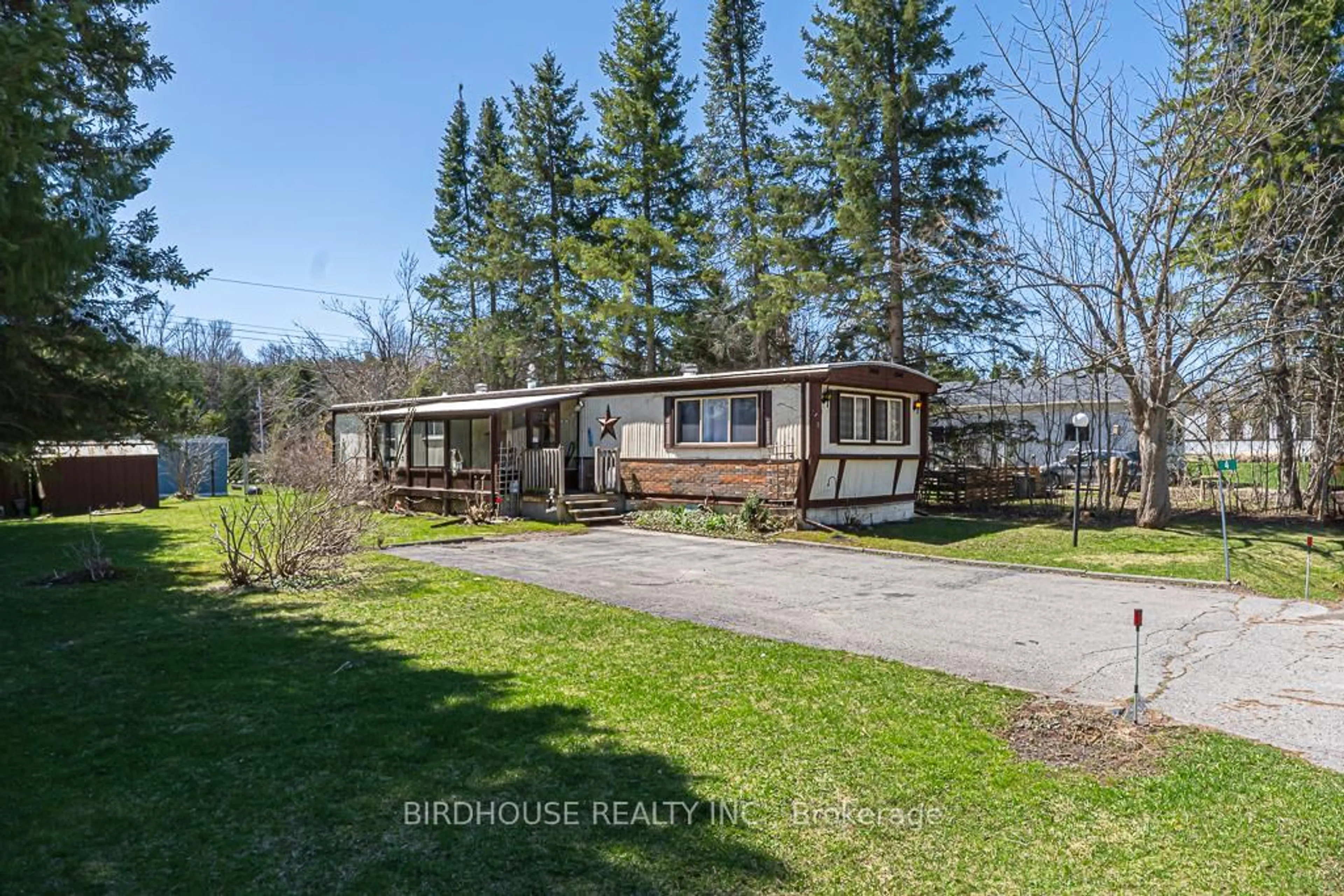 A pic from outside/outdoor area/front of a property/back of a property/a pic from drone, water/lake/river/ocean view for 4 Park Cres, Kawartha Lakes Ontario K9V 0H5