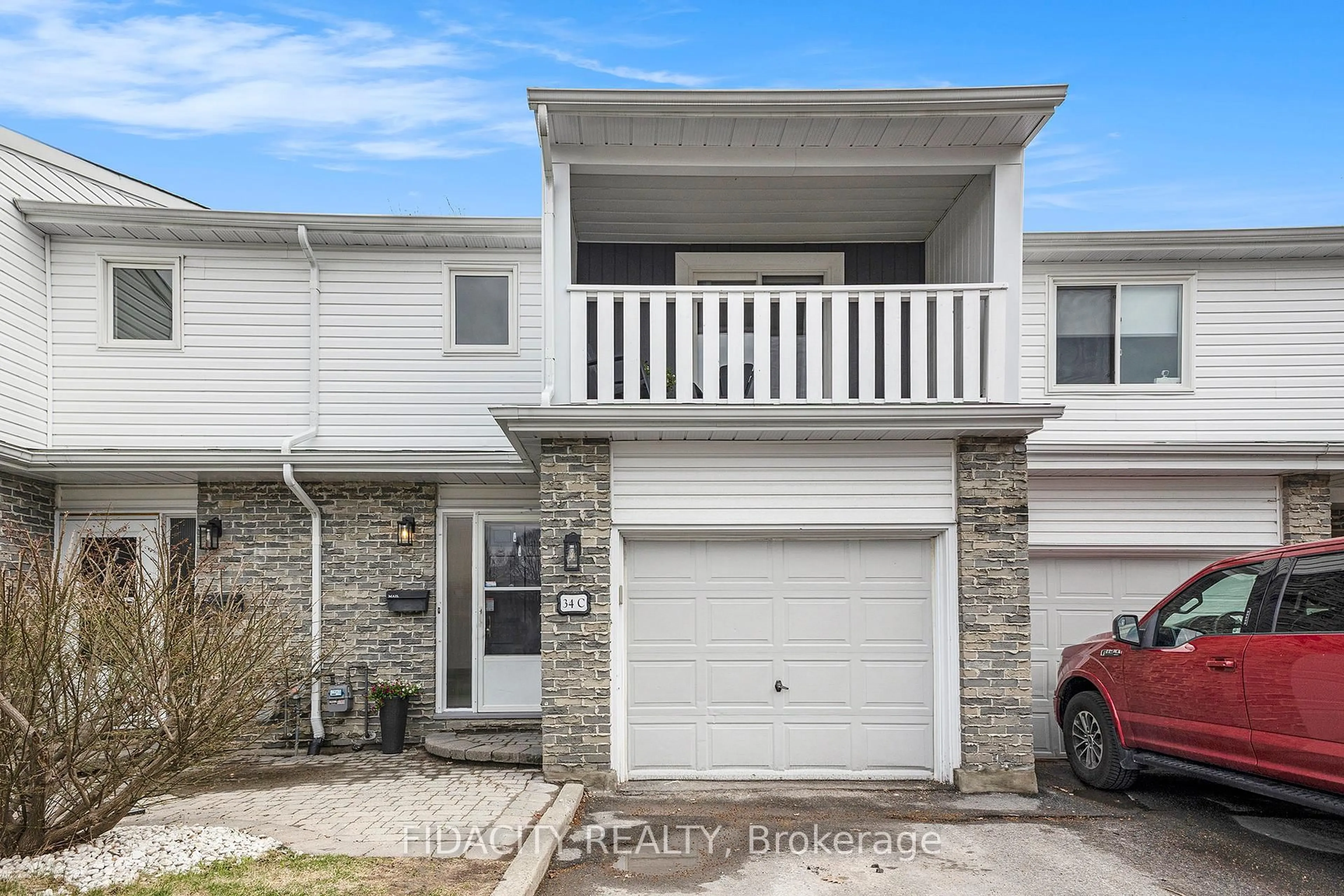 Home with vinyl exterior material, street for 34 Black Forest Lane #C, Ottawa Ontario K2H 5C8