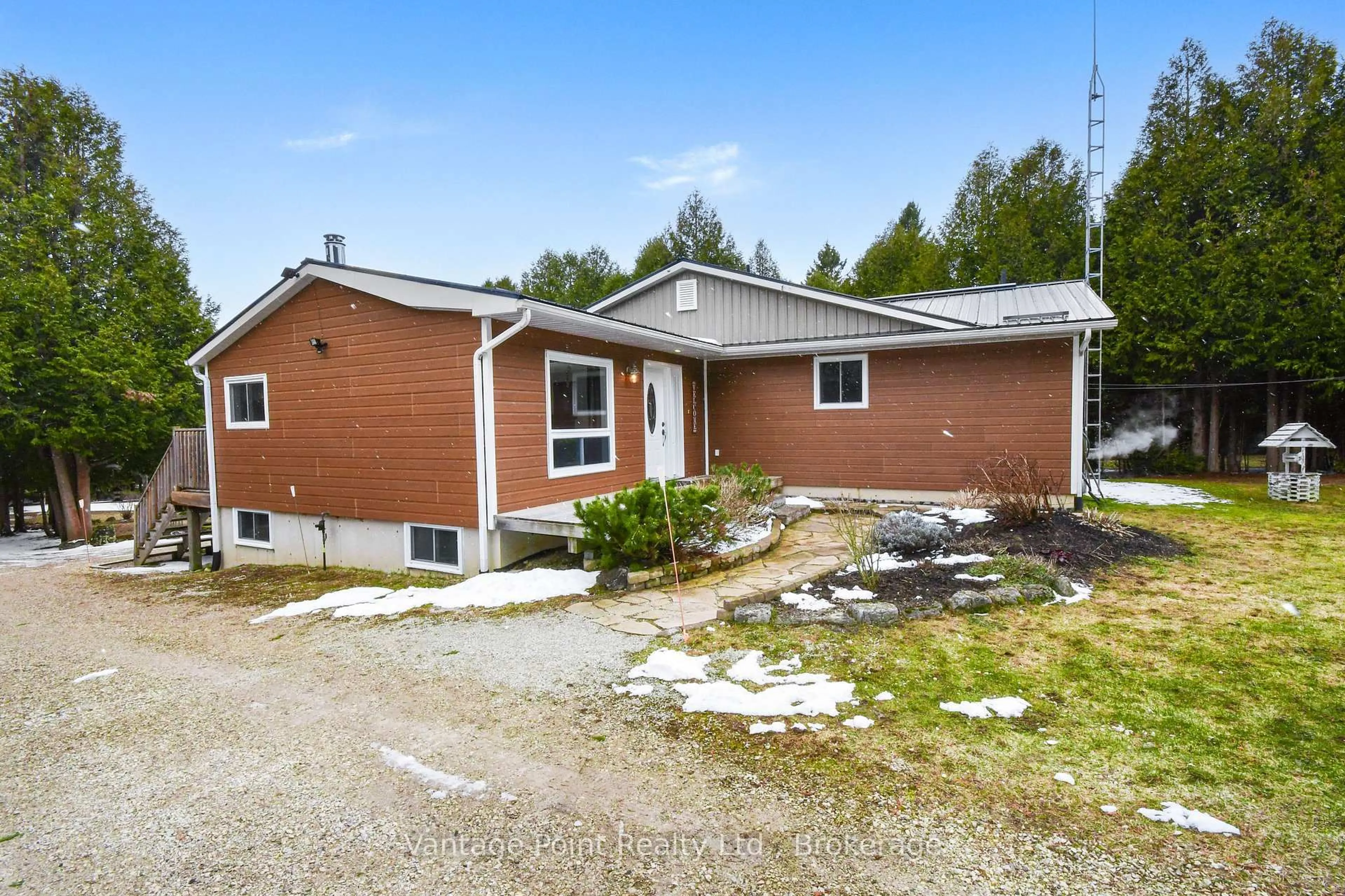 Home with vinyl exterior material, street for 447077 10th Concession, Grey Highlands Ontario N0C 1E0