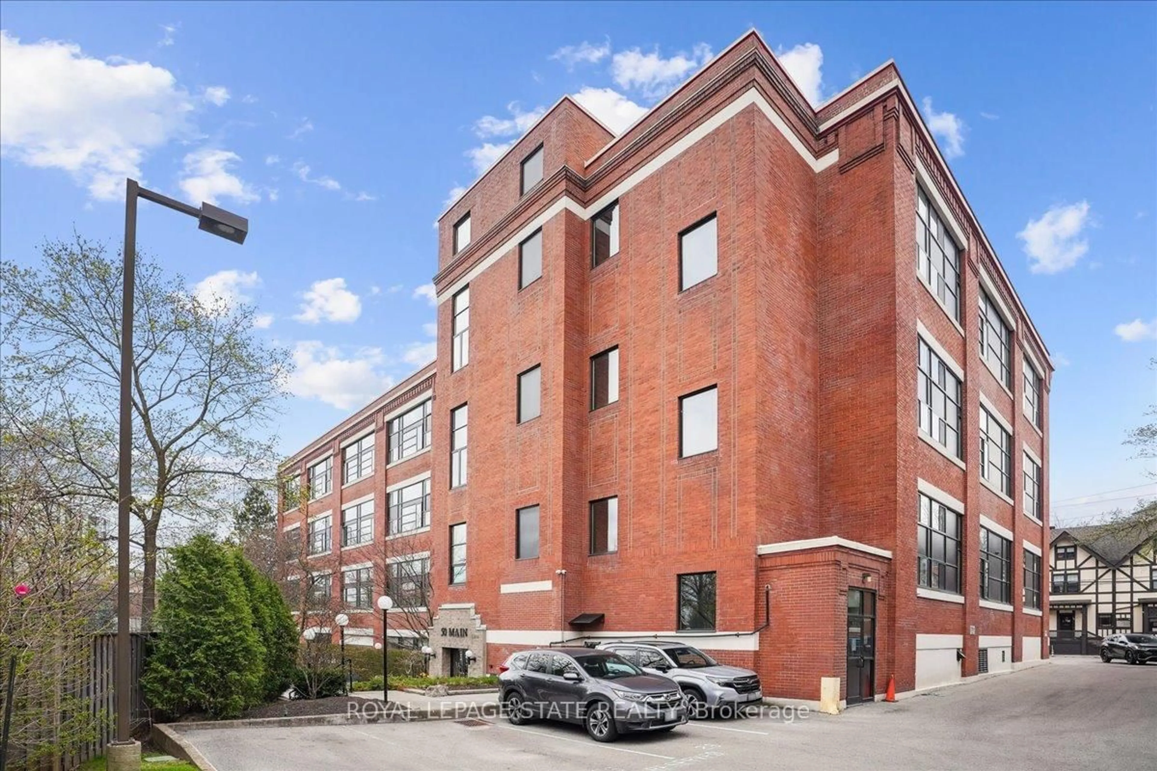 Home with brick exterior material, building for 50 Main St #313, Hamilton Ontario L9H 6P8