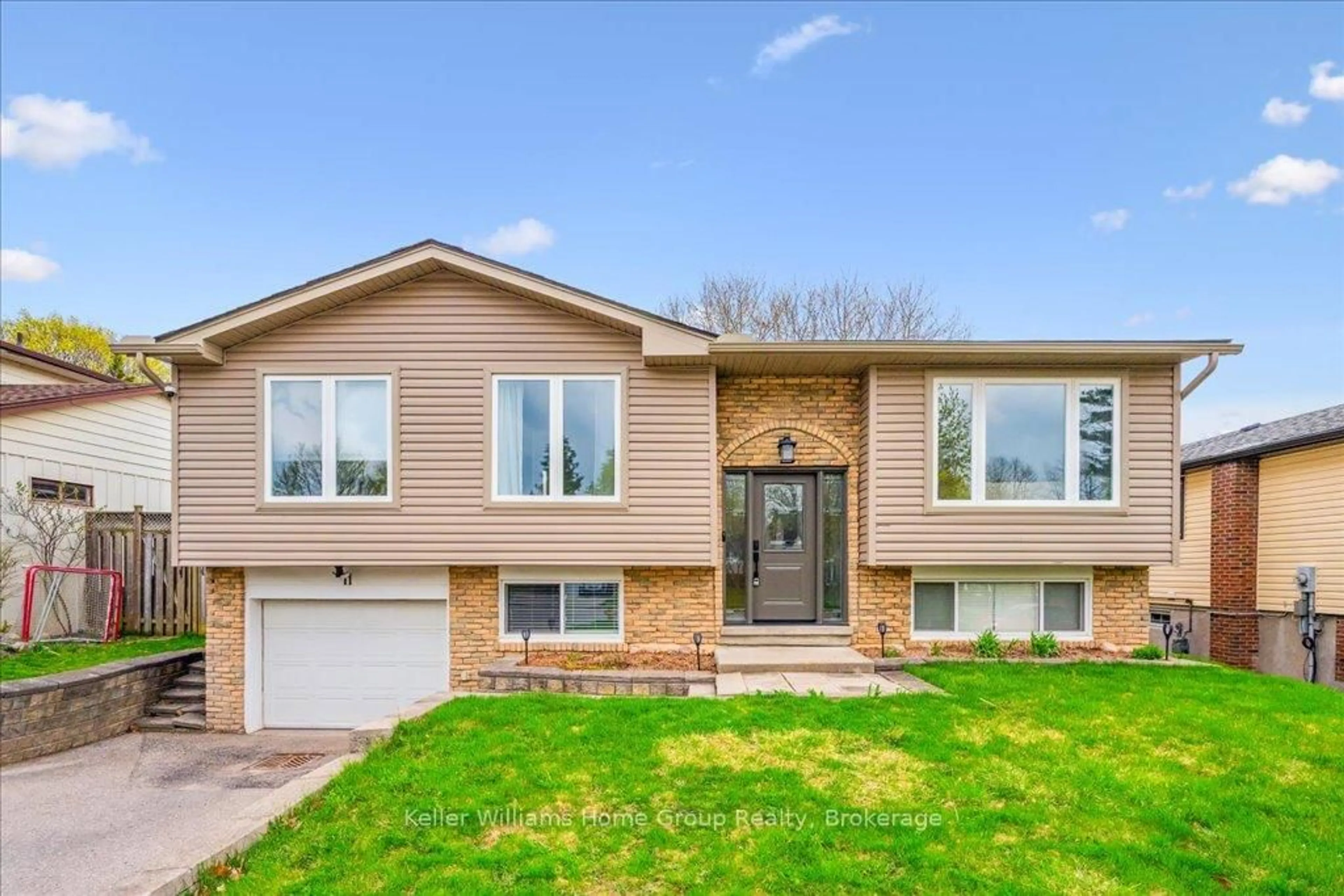 Home with vinyl exterior material, street for 11 Fairmeadow Dr, Guelph Ontario N1H 6X2
